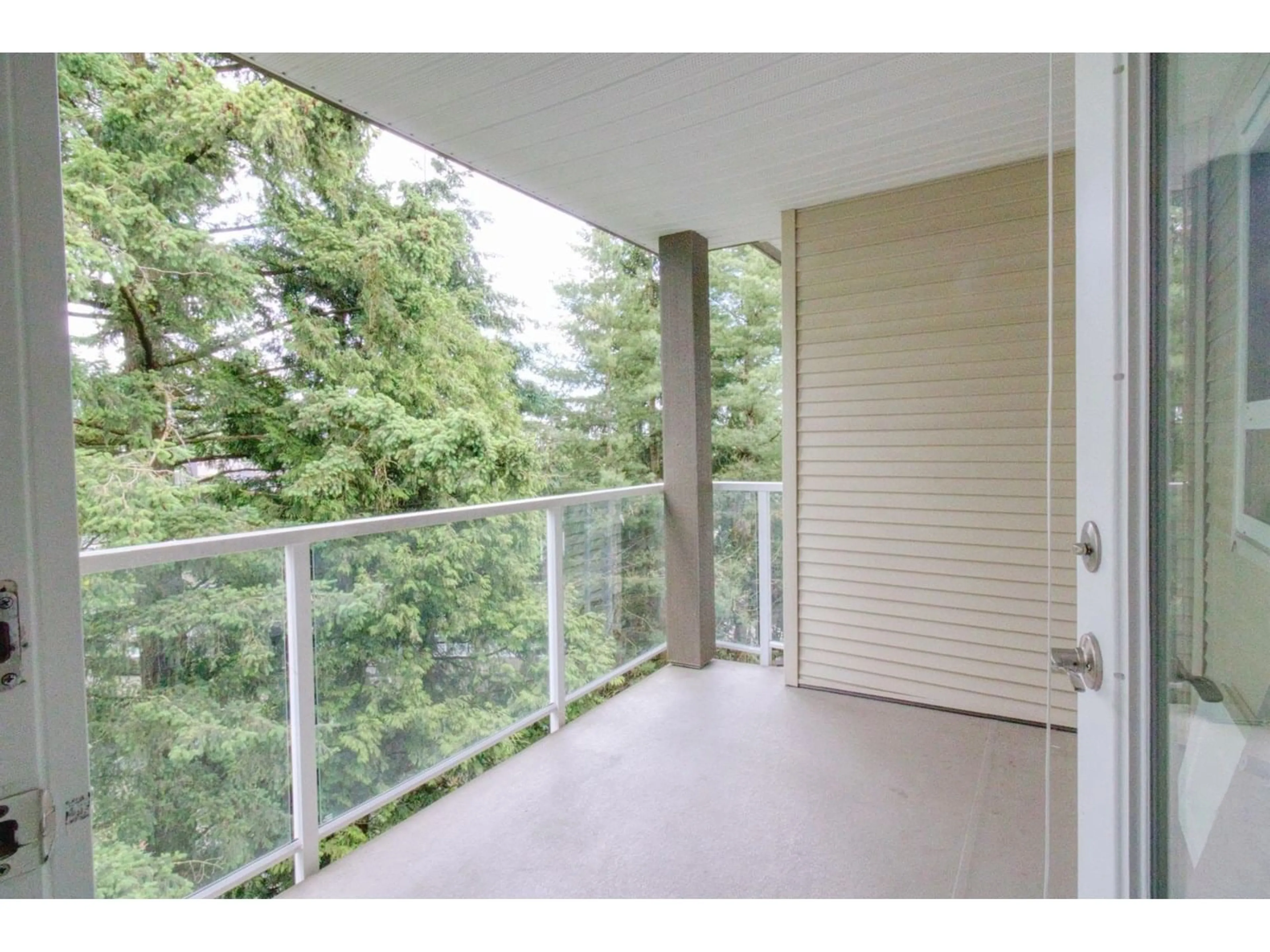 Balcony in the apartment, forest/trees view for 410 - 15895 84, Surrey British Columbia V4N0W7
