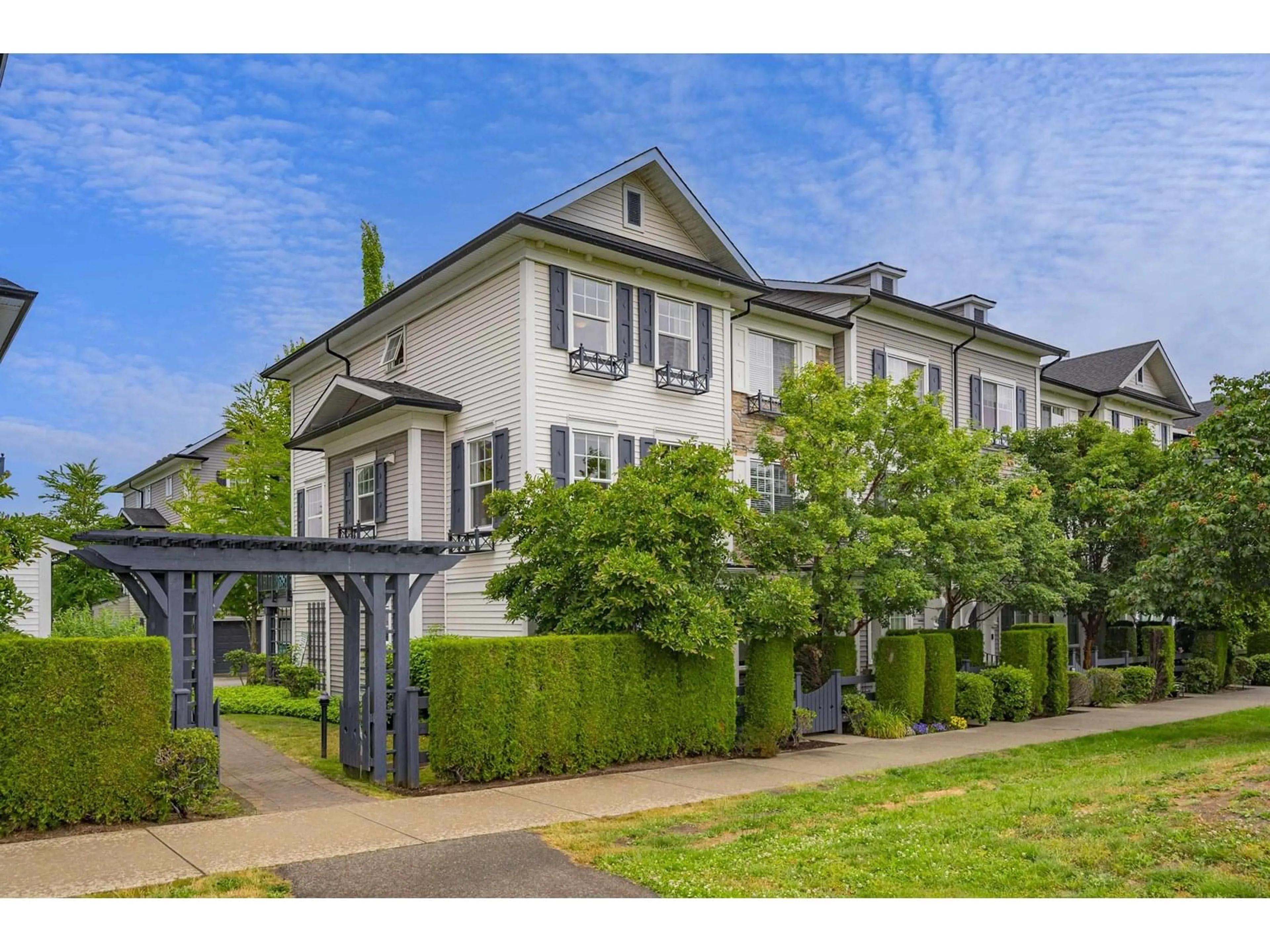 A pic from outside/outdoor area/front of a property/back of a property/a pic from drone, street for 9 - 7348 192A, Surrey British Columbia V4N6J2