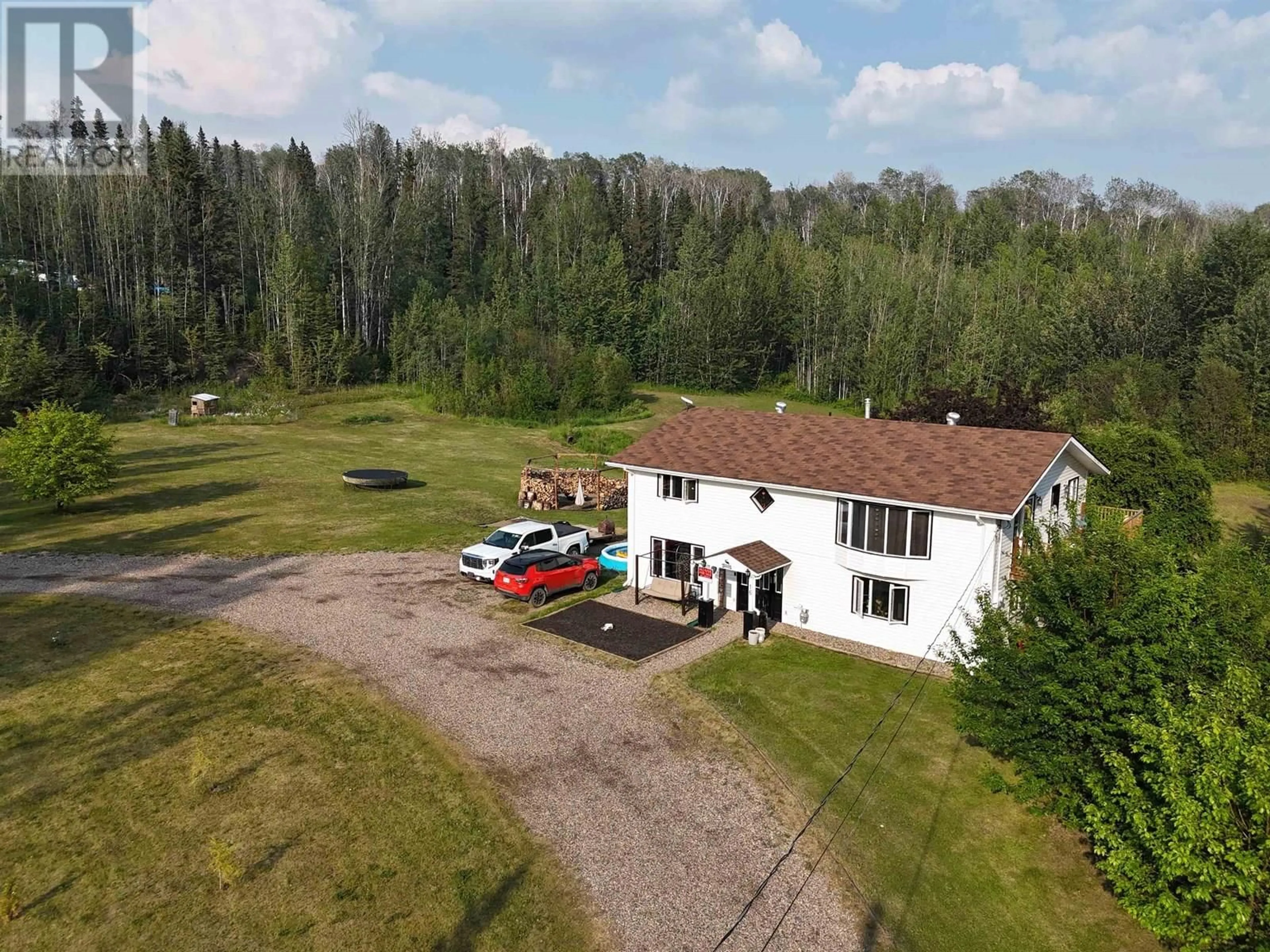 A pic from outside/outdoor area/front of a property/back of a property/a pic from drone, building for 16 WALSH ROAD, Fort Nelson British Columbia V0C1R0