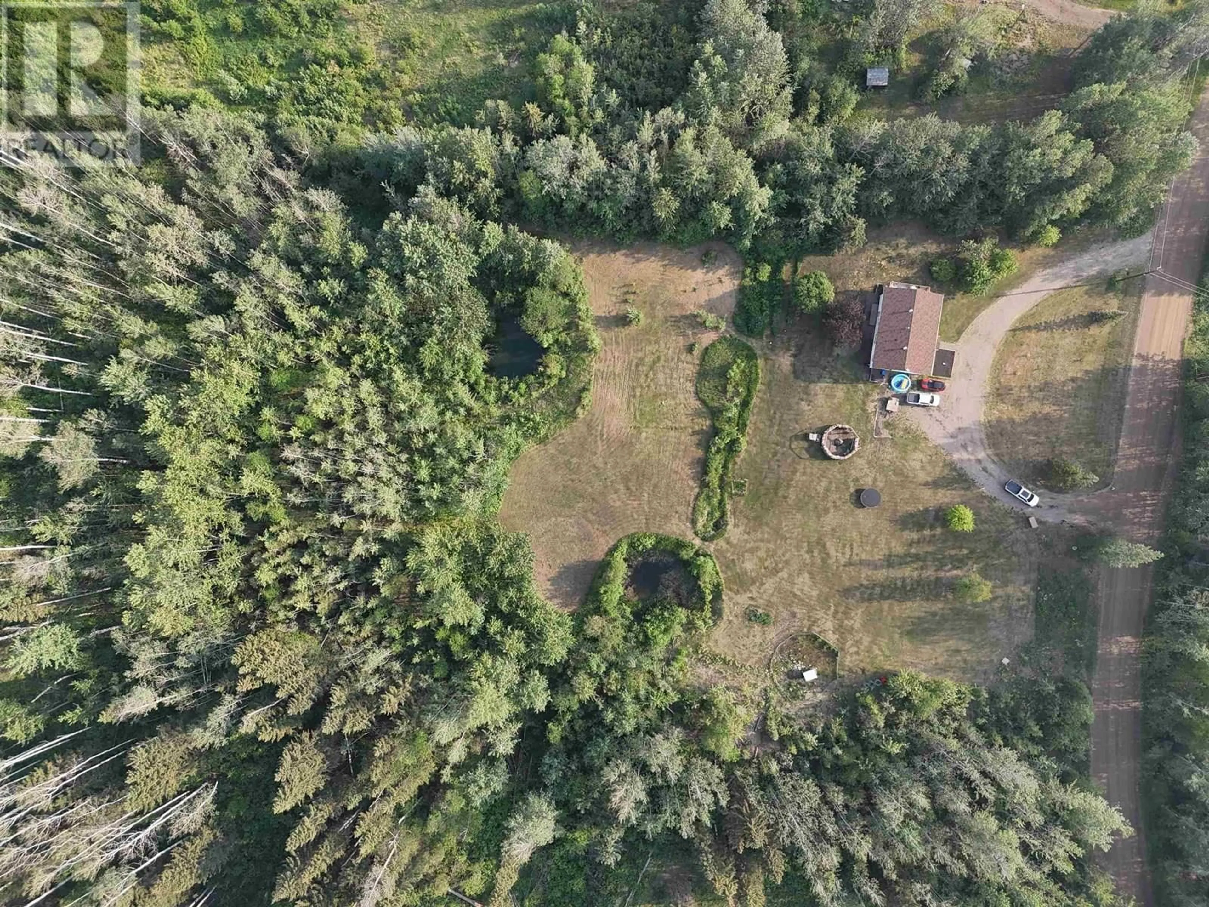 A pic from outside/outdoor area/front of a property/back of a property/a pic from drone, forest/trees view for 16 WALSH ROAD, Fort Nelson British Columbia V0C1R0