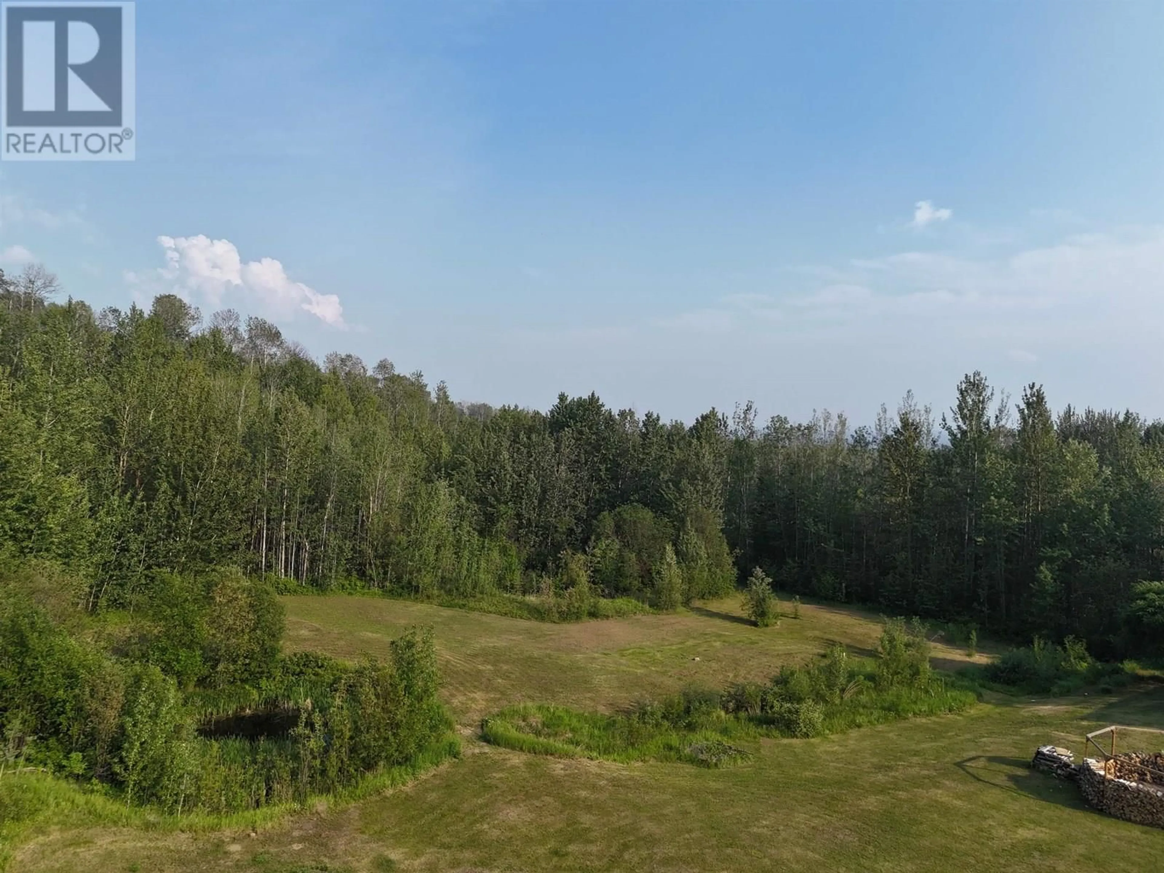 A pic from outside/outdoor area/front of a property/back of a property/a pic from drone, forest/trees view for 16 WALSH ROAD, Fort Nelson British Columbia V0C1R0
