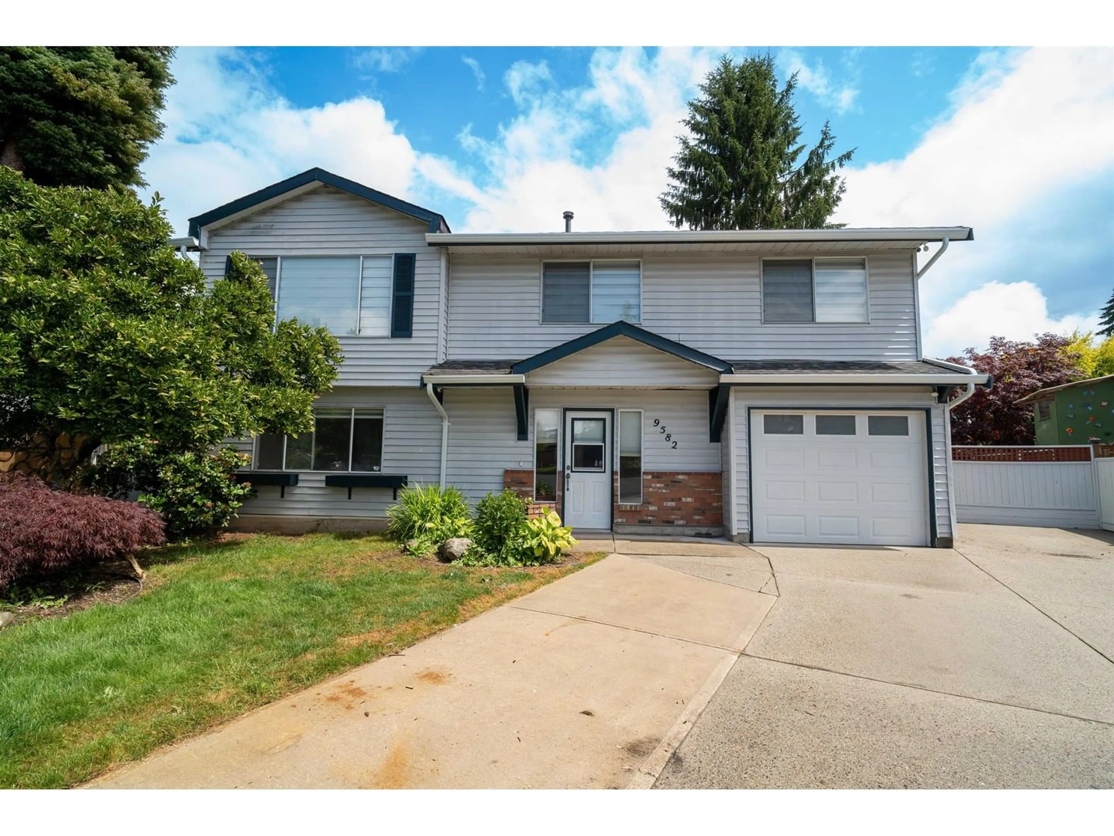 Home with vinyl exterior material, street for 9582 212B, Langley British Columbia V1M1N4