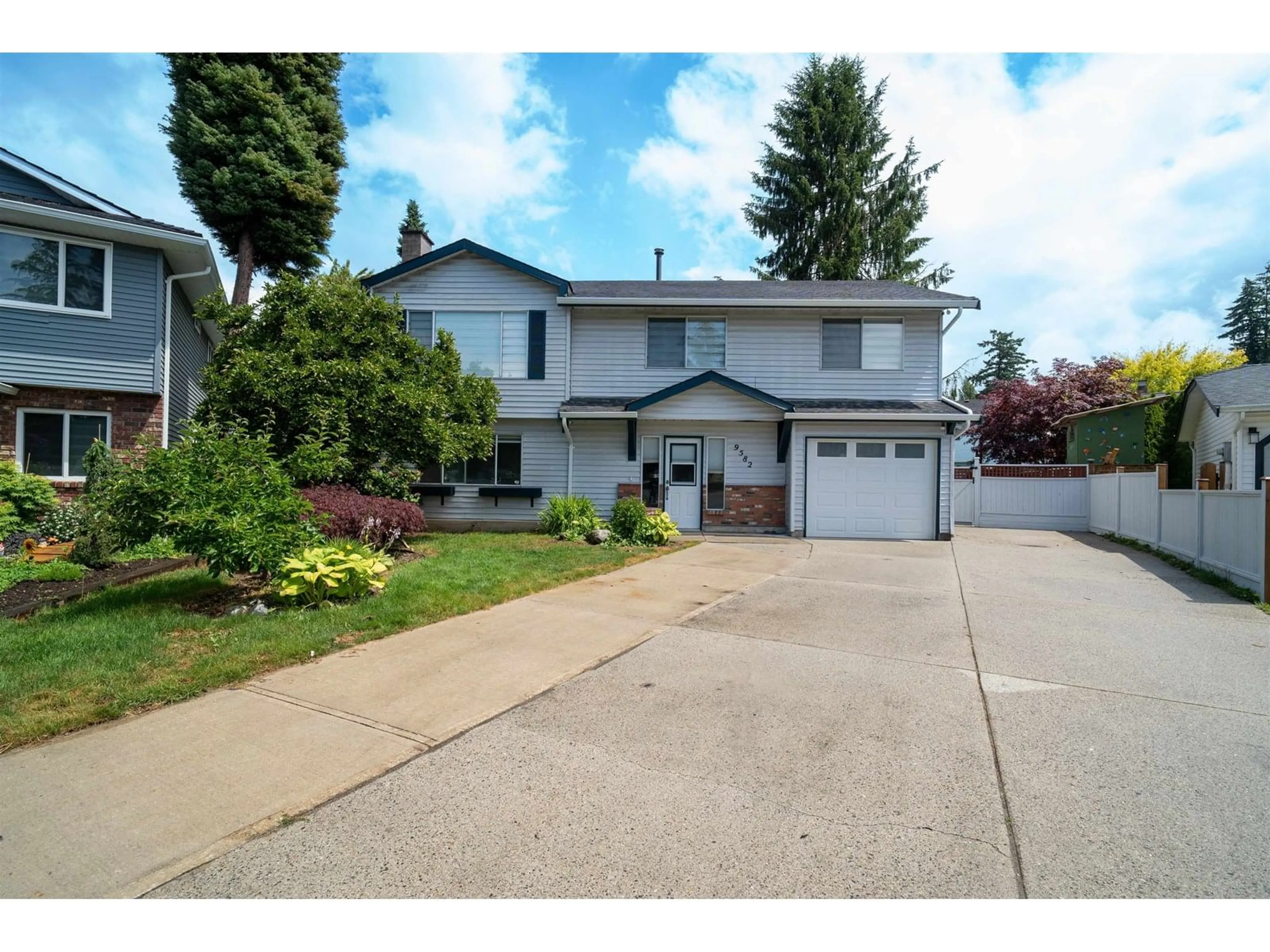 Home with vinyl exterior material, street for 9582 212B, Langley British Columbia V1M1N4