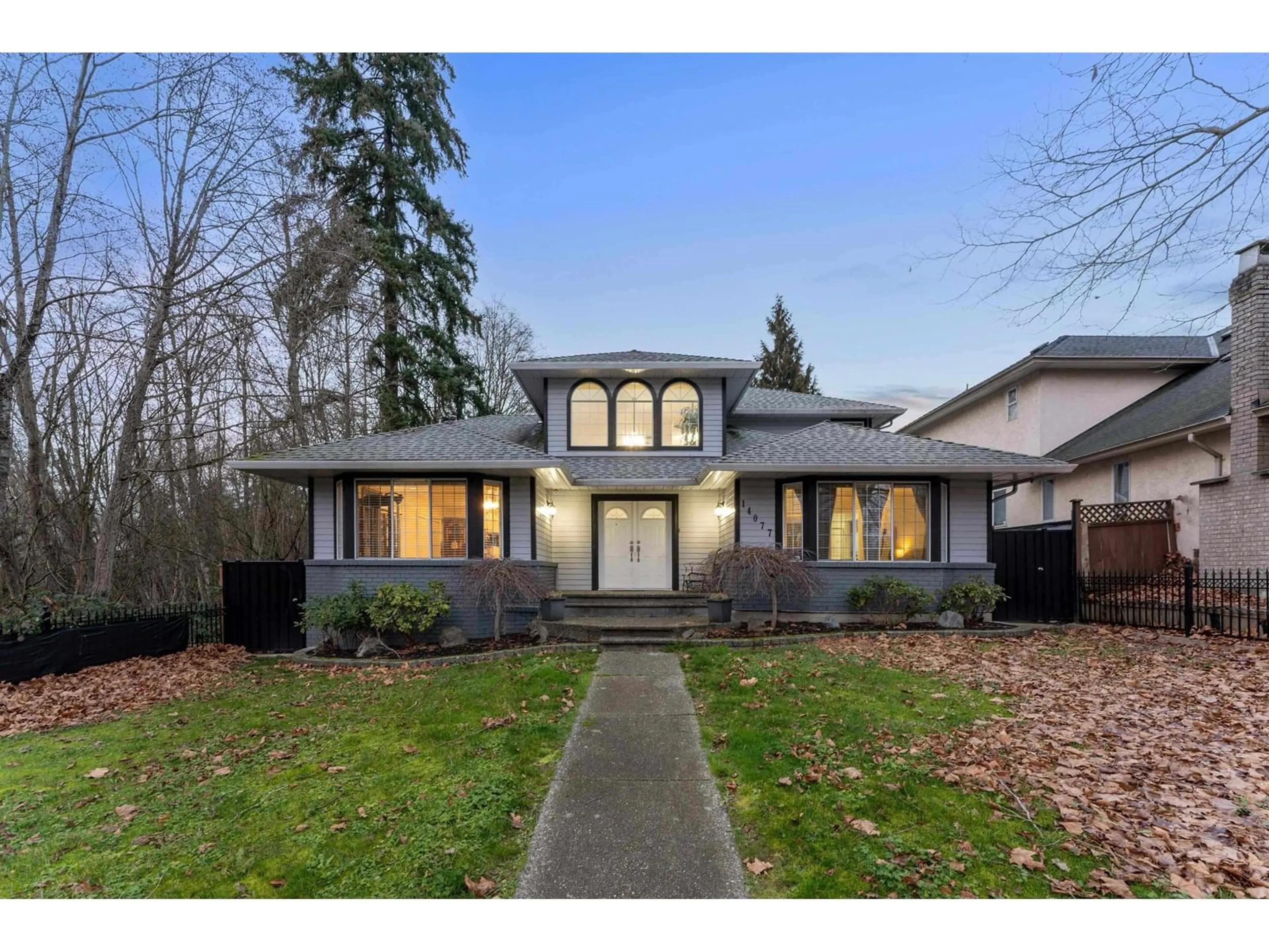 Home with vinyl exterior material, street for 14077 84, Surrey British Columbia V3W0V5