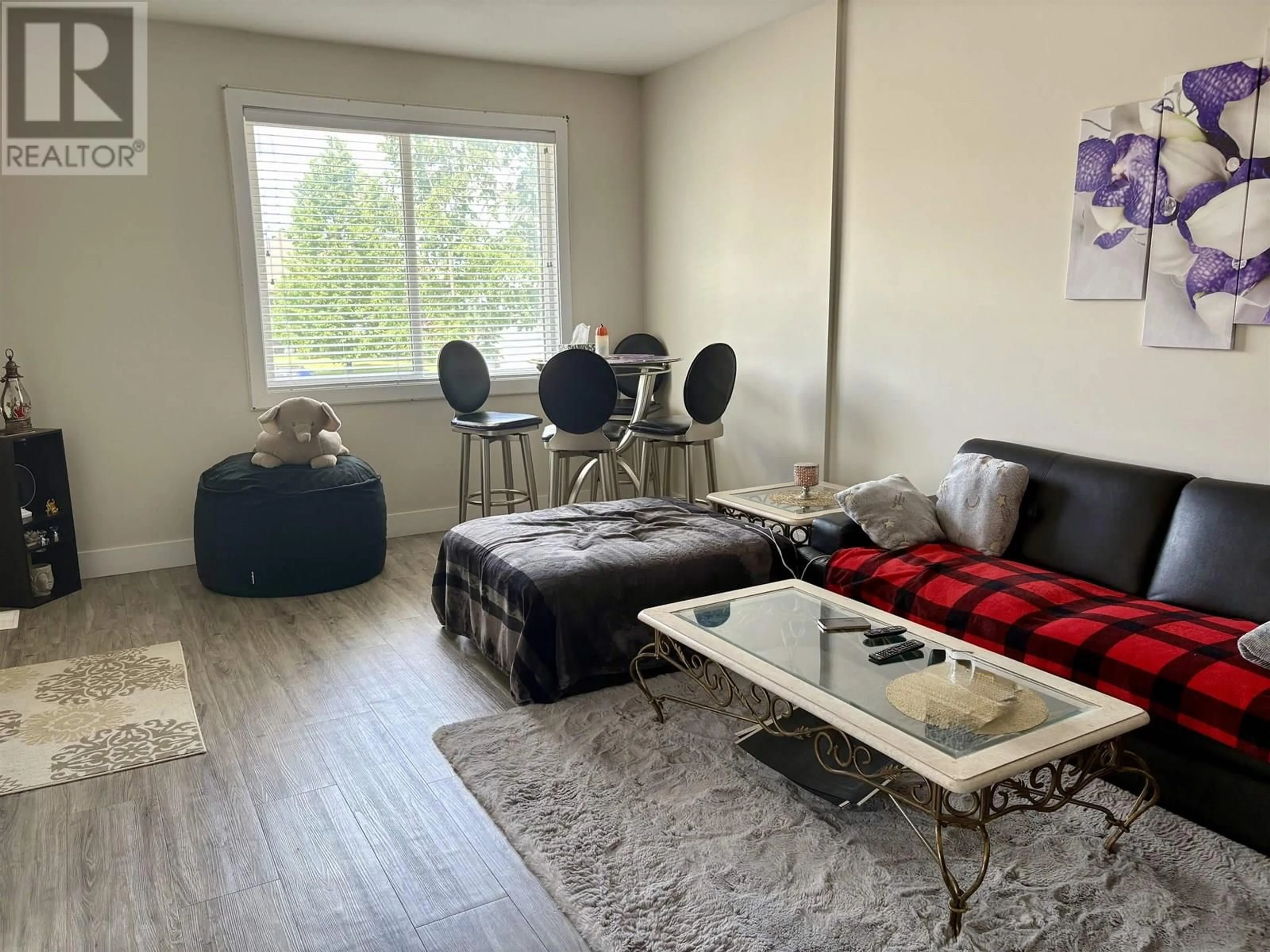 Living room with furniture, wood/laminate floor for 3803 PINEWOOD AVENUE, Prince George British Columbia V2N4W4