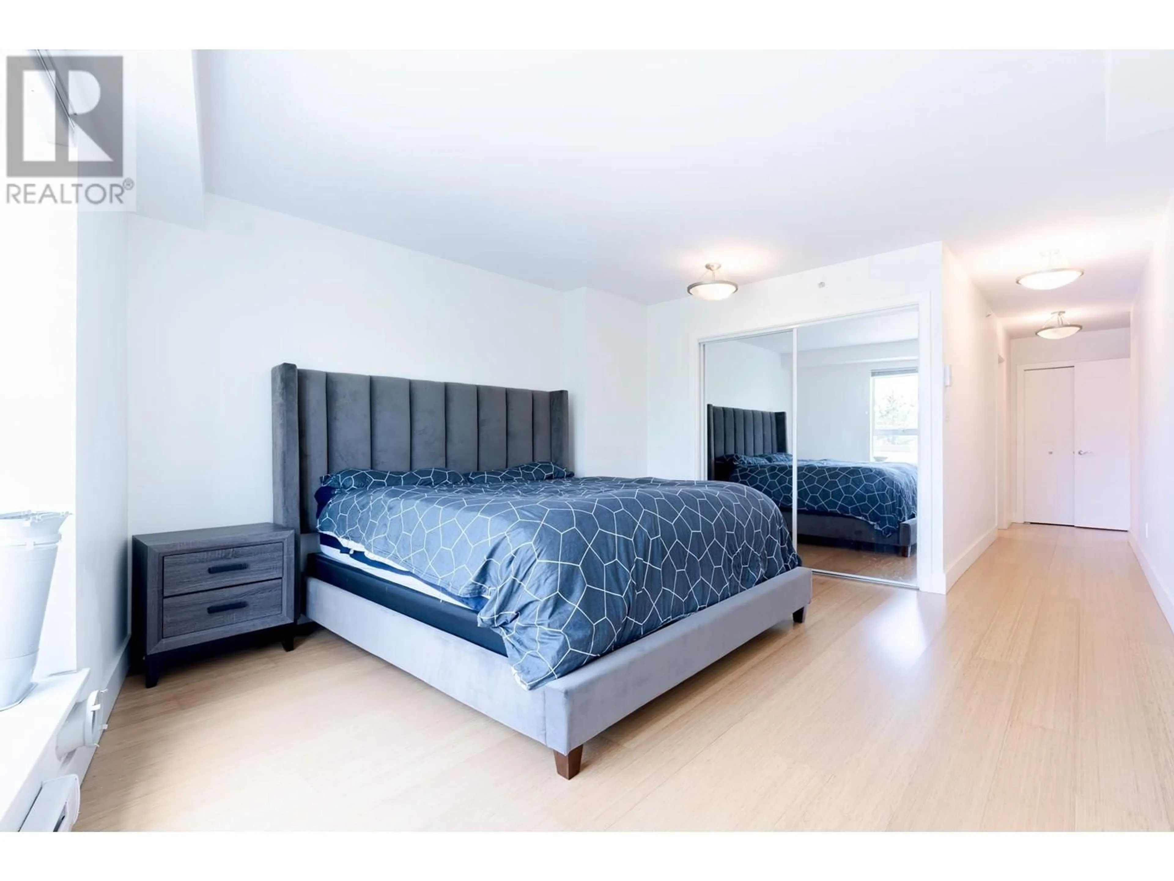Bedroom with bed, wood/laminate floor for 202 - 1188 QUEBEC STREET, Vancouver British Columbia V6A4B2