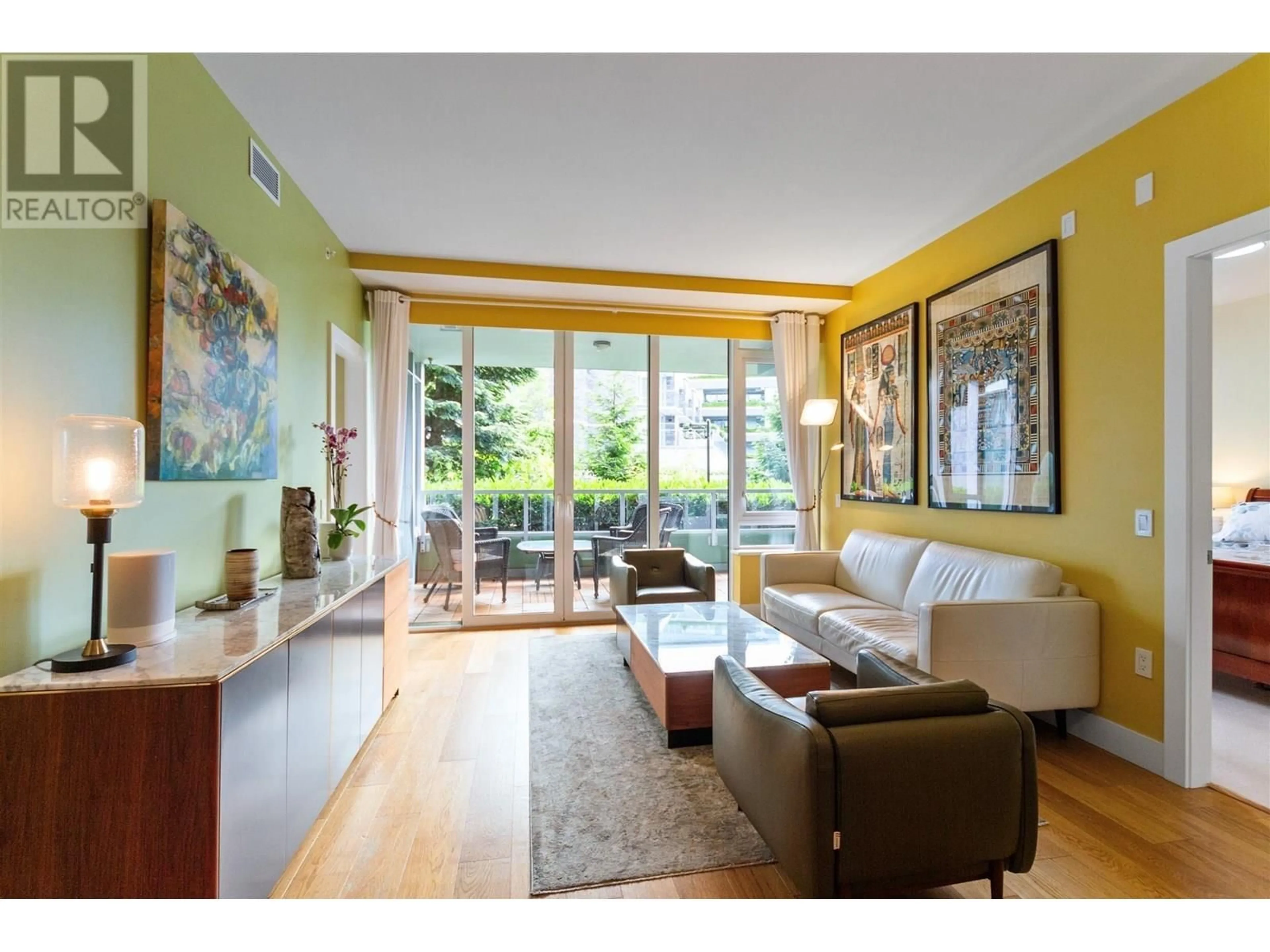 Living room with furniture, wood/laminate floor for 200 - 866 ARTHUR ERICKSON PLACE, West Vancouver British Columbia V7T0B2