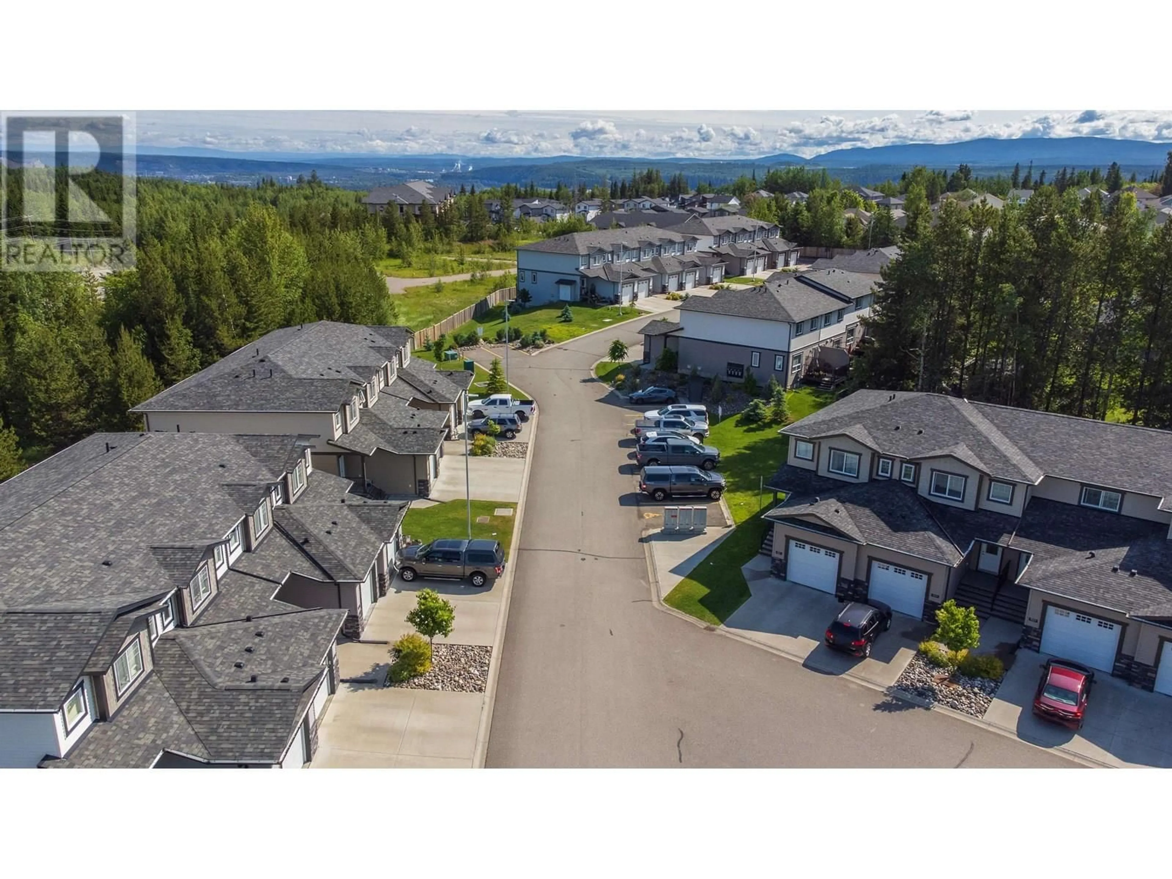 A pic from outside/outdoor area/front of a property/back of a property/a pic from drone, mountain view for 202 - 6798 WESTGATE AVENUE, Prince George British Columbia V2N0H6