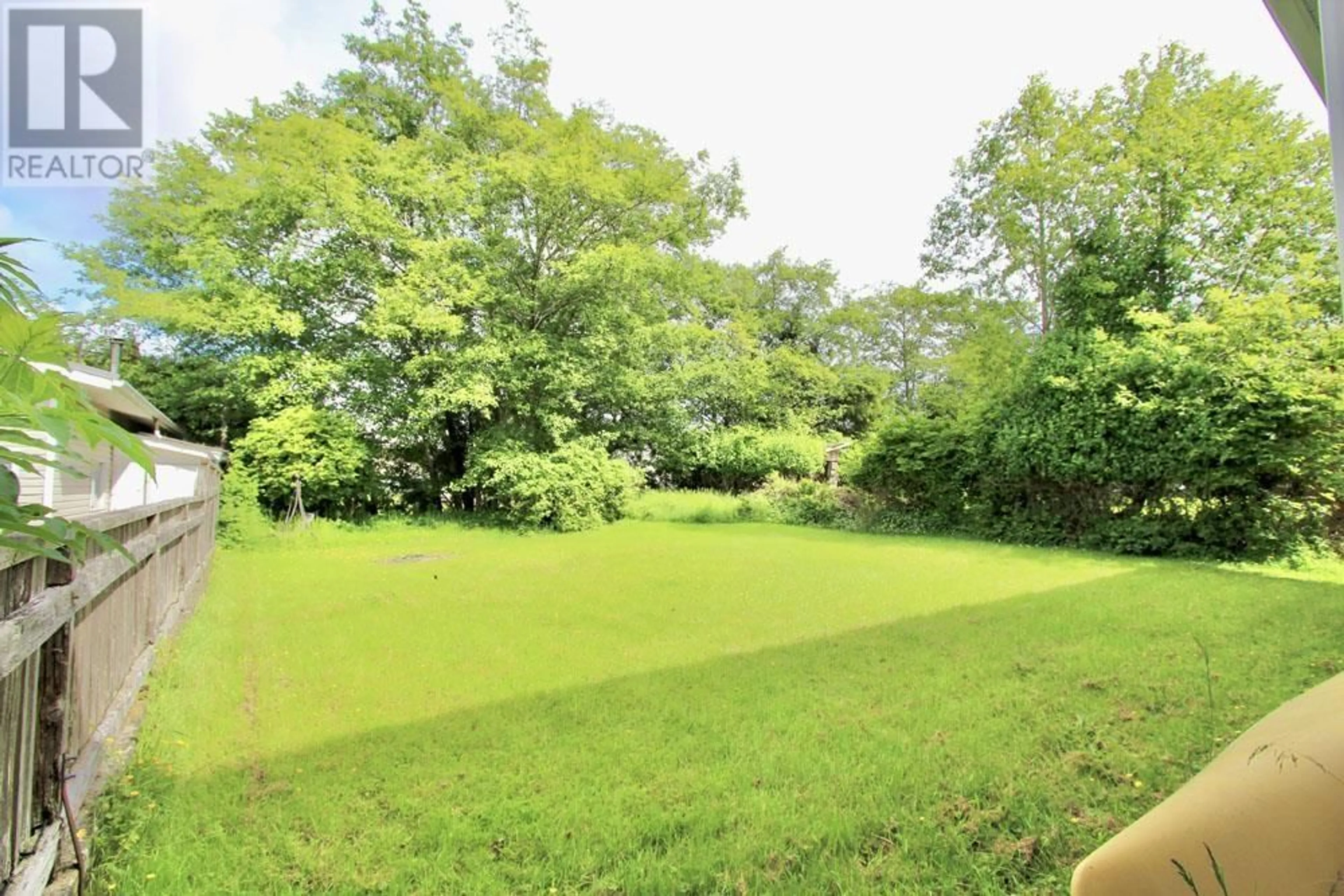 A pic from outside/outdoor area/front of a property/back of a property/a pic from drone, forest/trees view for 33 YAKOUN STREET, Port Clements British Columbia V0T1R0