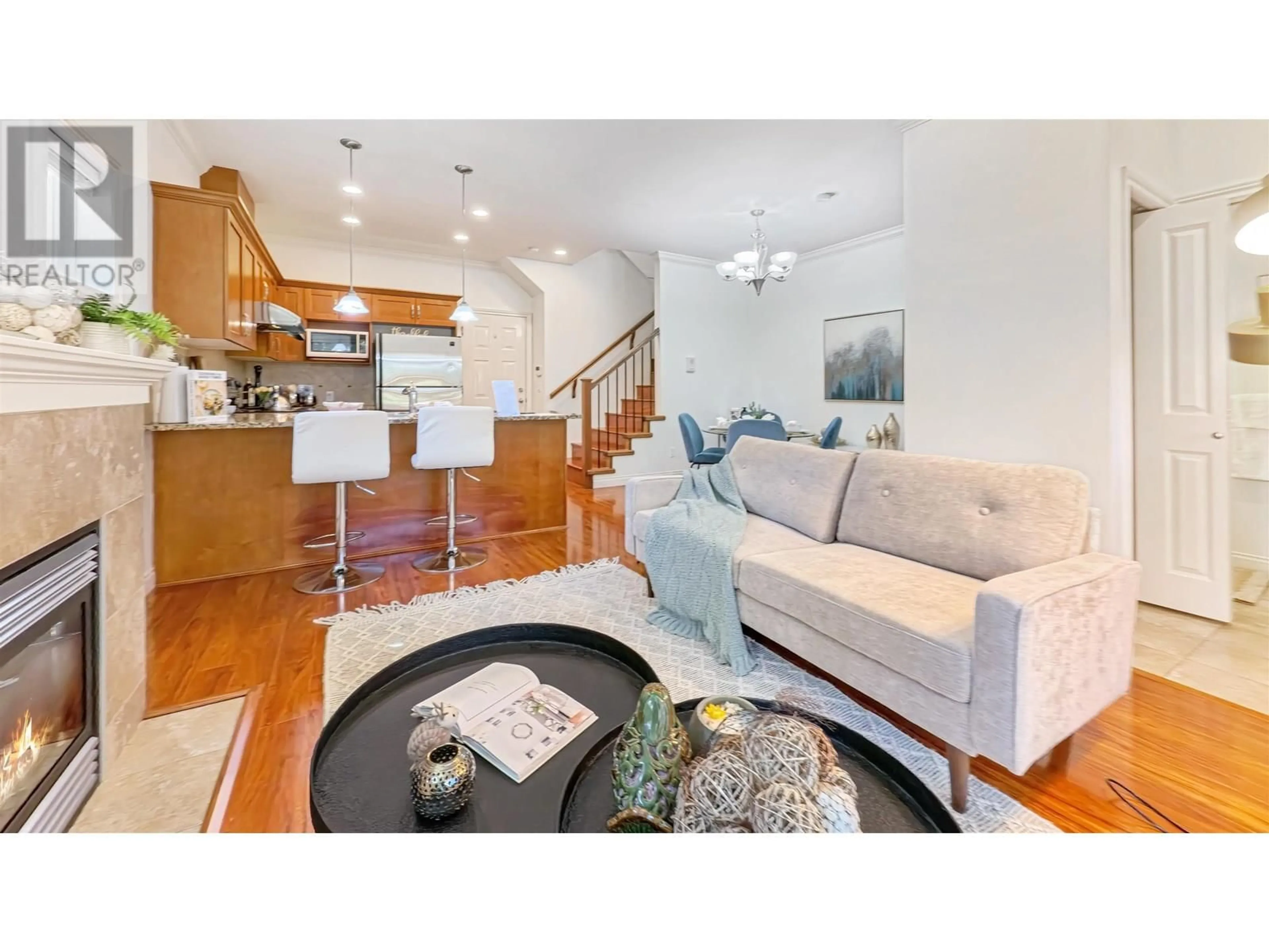 Living room with furniture, wood/laminate floor for 1 - 8311 NO. 2 ROAD, Richmond British Columbia V7C3M2