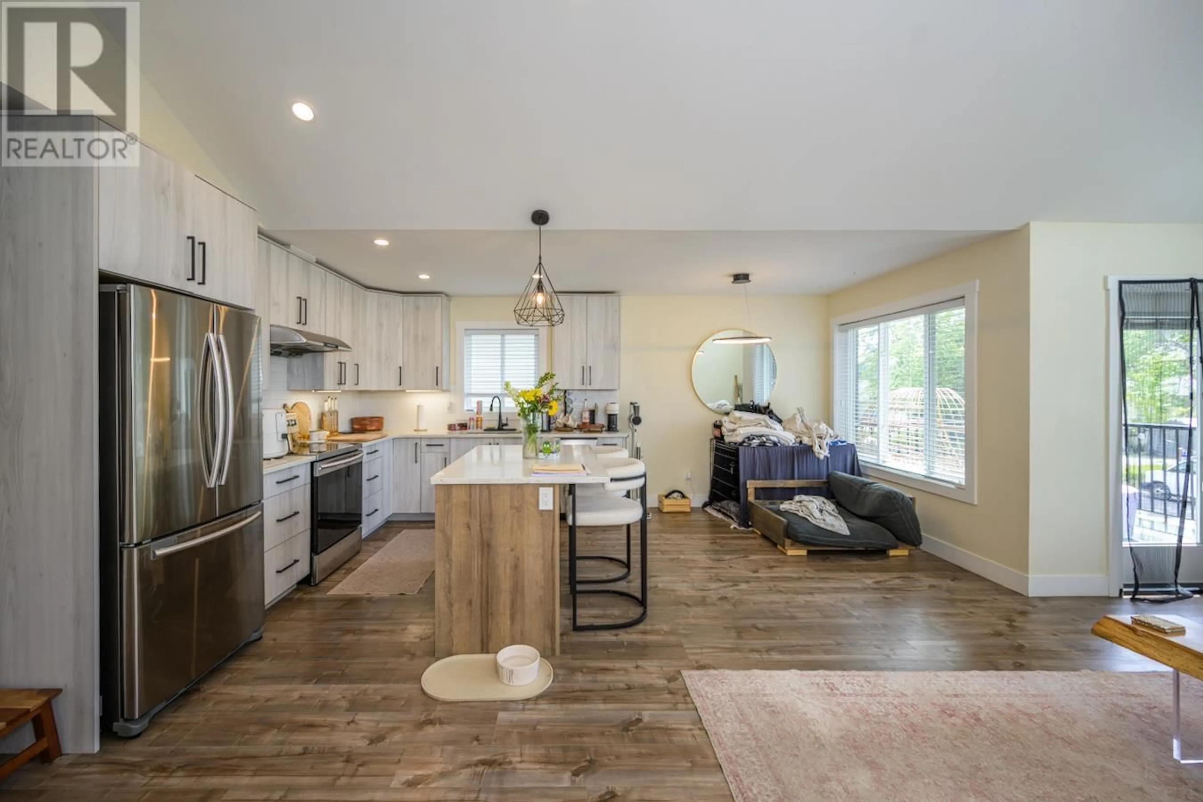 Open concept kitchen, wood/laminate floor for 1652 9TH AVENUE, Prince George British Columbia V2L3S1