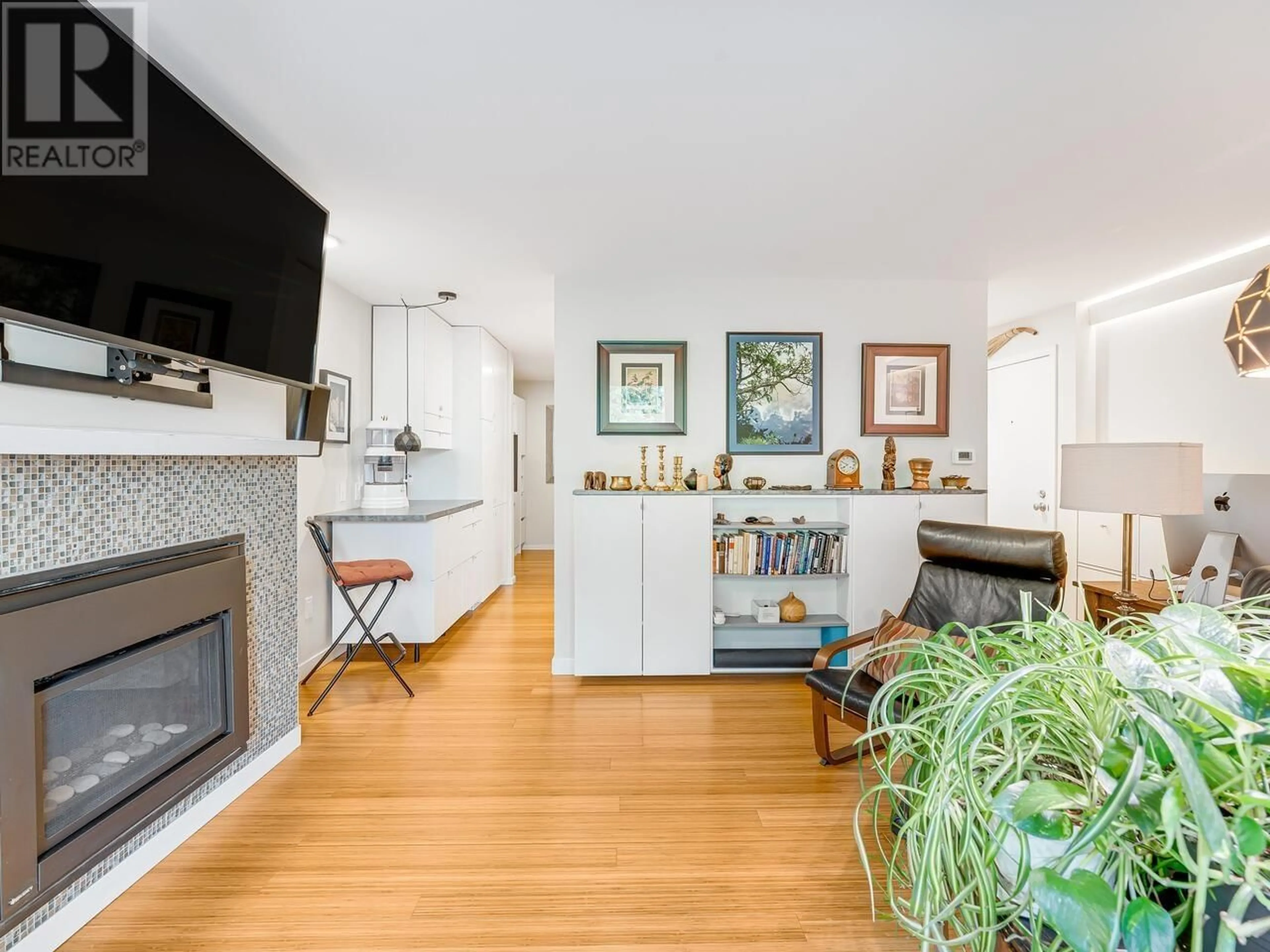 Living room with furniture, wood/laminate floor for 204 - 550 6TH AVENUE, Vancouver British Columbia V5T4H2