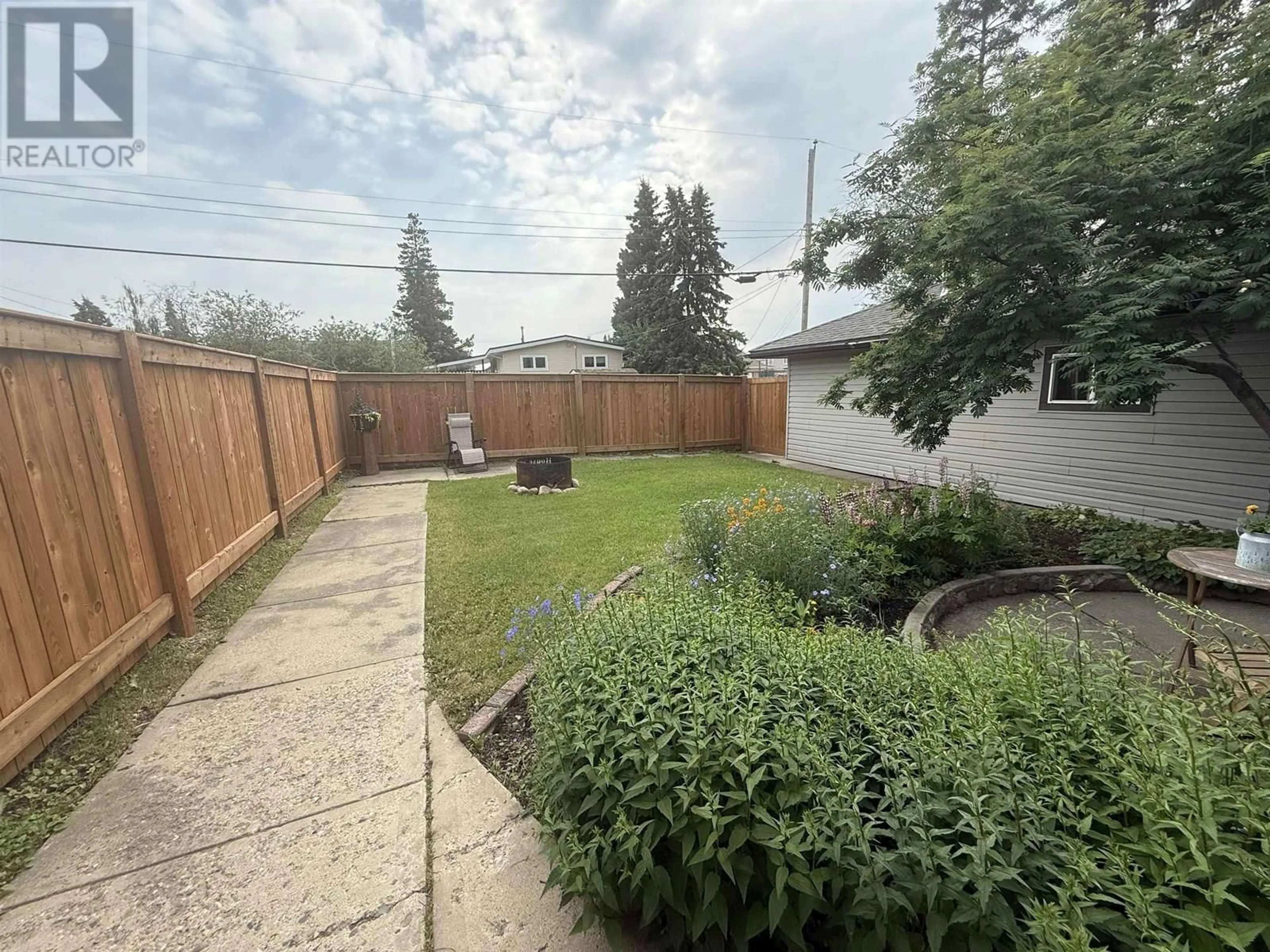 A pic from outside/outdoor area/front of a property/back of a property/a pic from drone, street for 9223 104 AVENUE, Fort St. John British Columbia V1J2J6