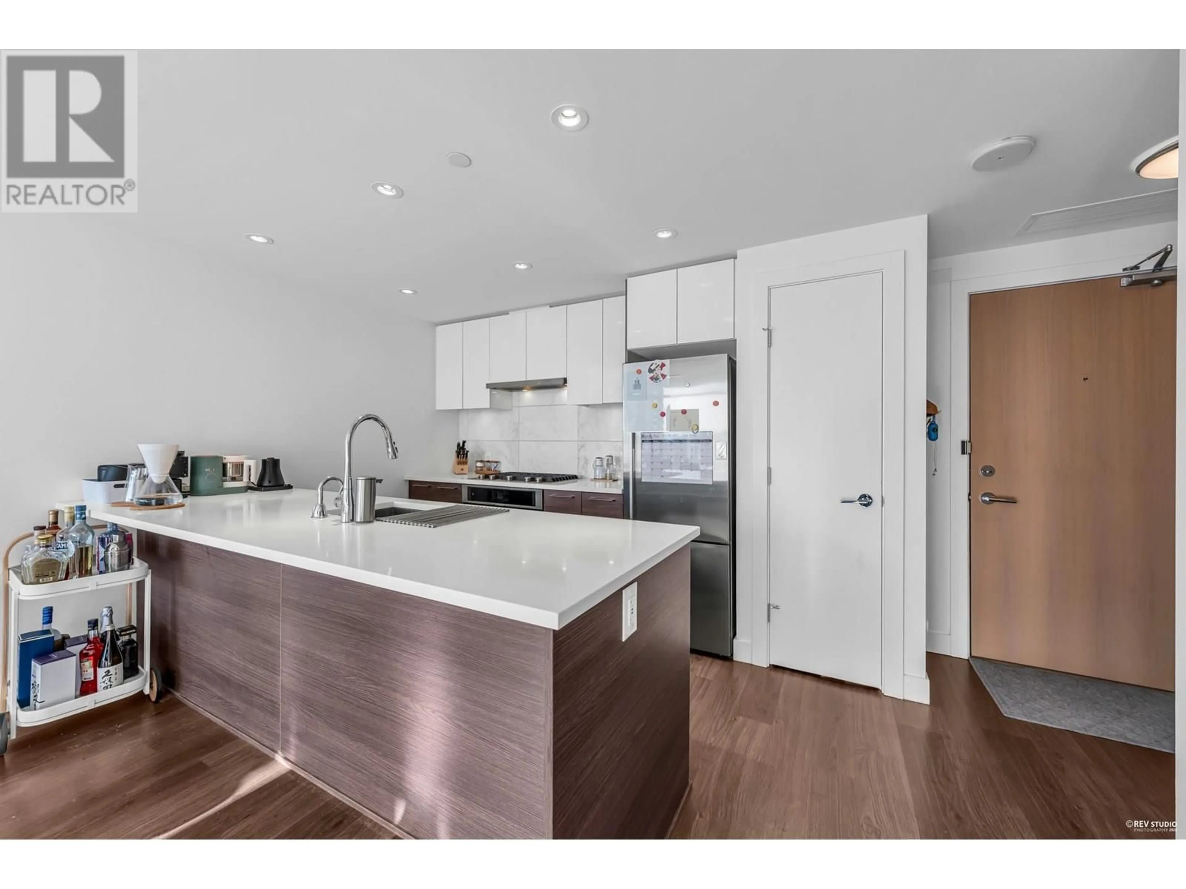Open concept kitchen, wood/laminate floor for 716 - 3557 SAWMILL CRESCENT, Vancouver British Columbia V5S0E2