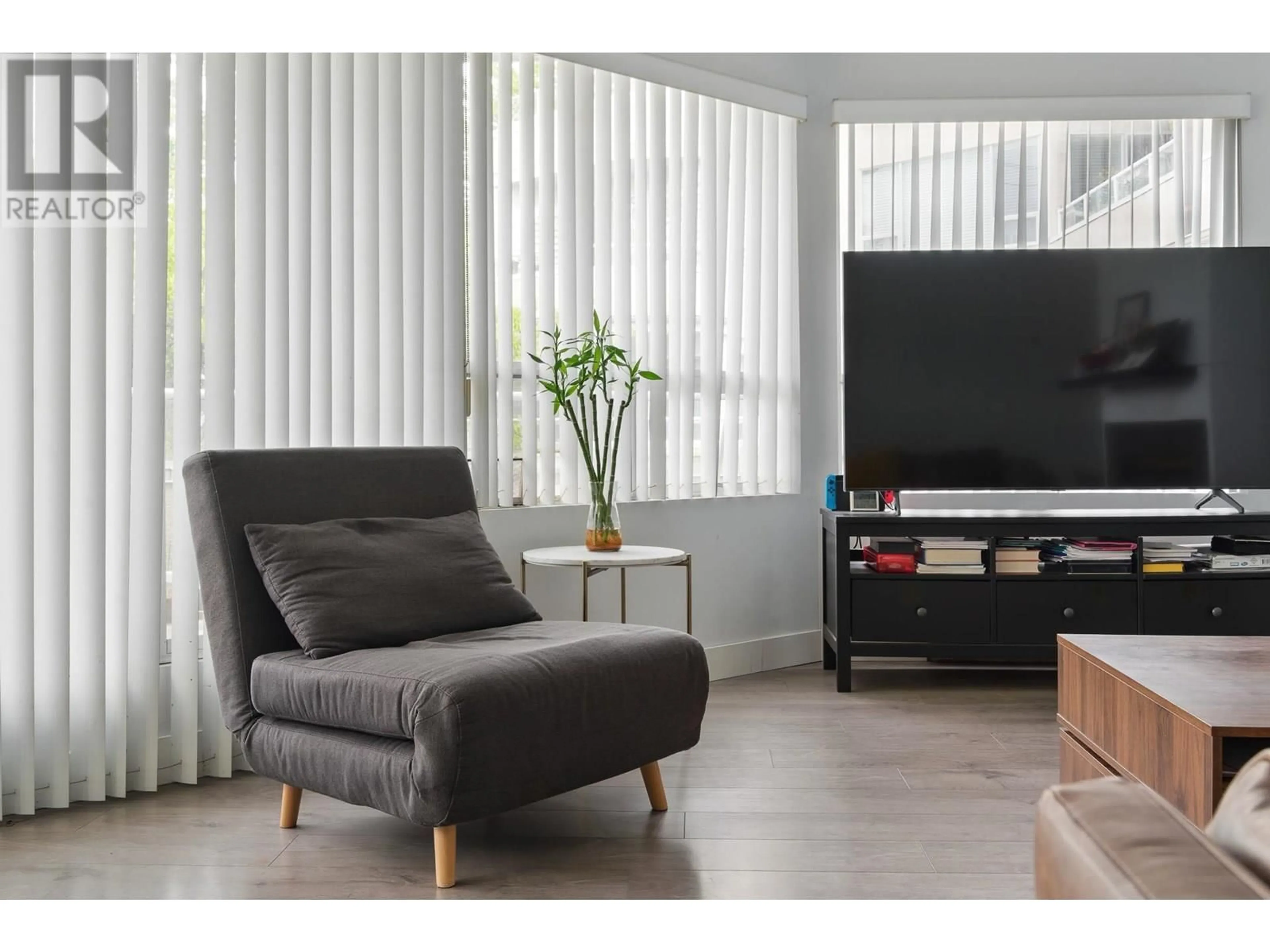 Living room with furniture, wood/laminate floor for 104 - 7480 GILBERT ROAD, Richmond British Columbia V7C3W2