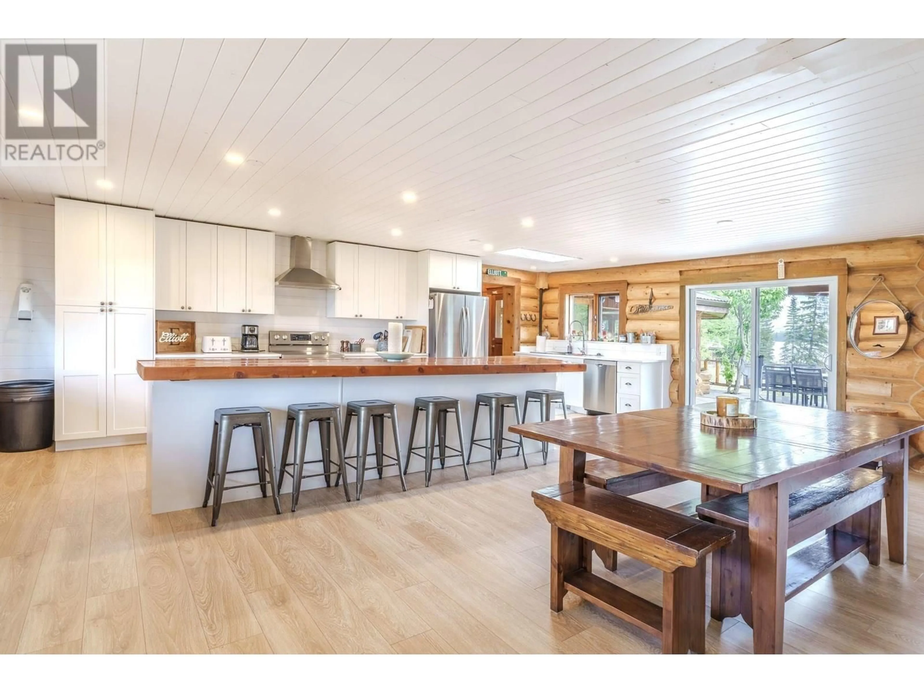 Open concept kitchen, wood/laminate floor for 7806 NORTH BONAPARTE ROAD, Bridge Lake British Columbia V0K1E0