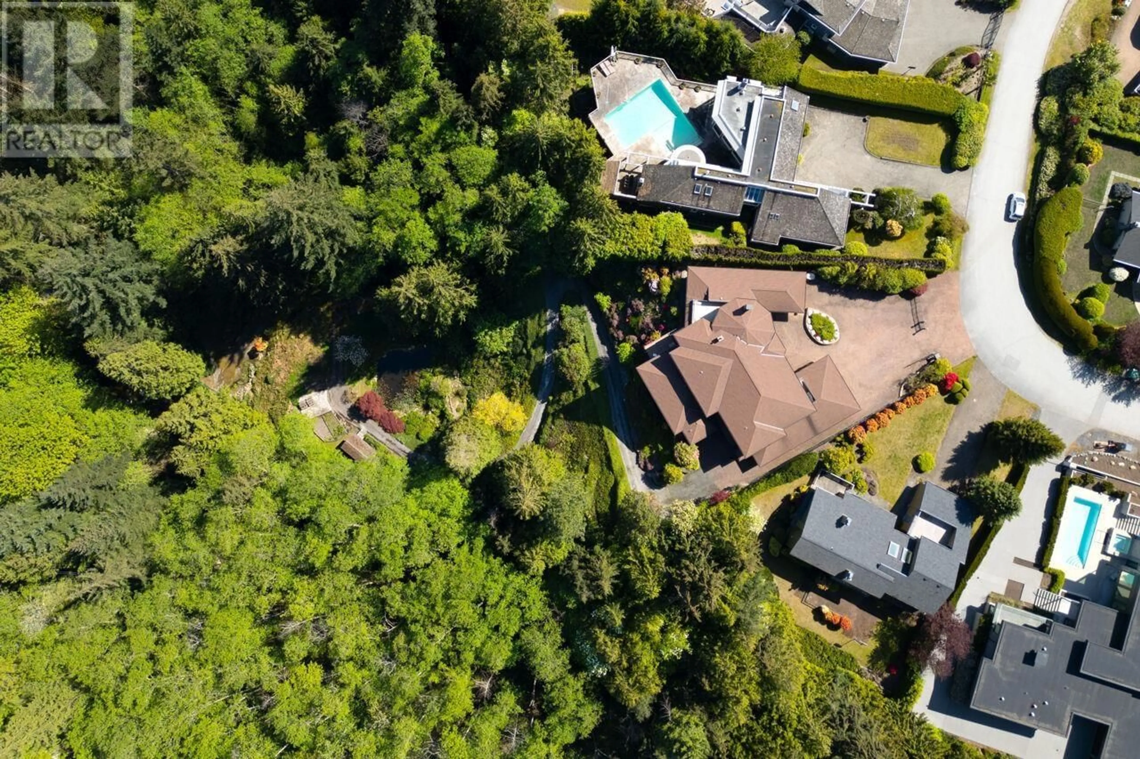 A pic from outside/outdoor area/front of a property/back of a property/a pic from drone, forest/trees view for 4228 ROCKRIDGE CRESCENT, West Vancouver British Columbia V7W1B1