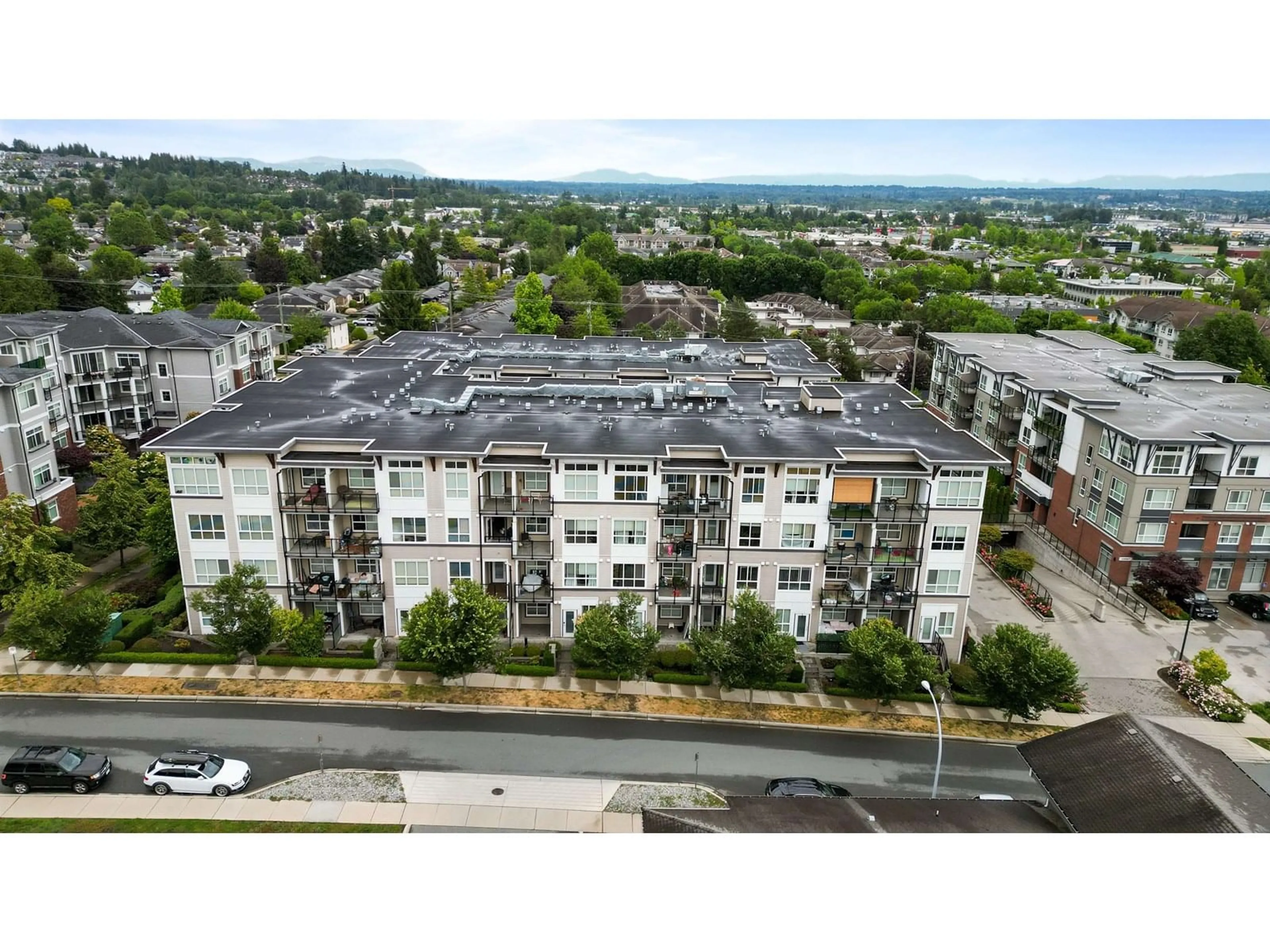 A pic from outside/outdoor area/front of a property/back of a property/a pic from drone, unknown for 108 - 6468 195A, Surrey British Columbia V4N6T1