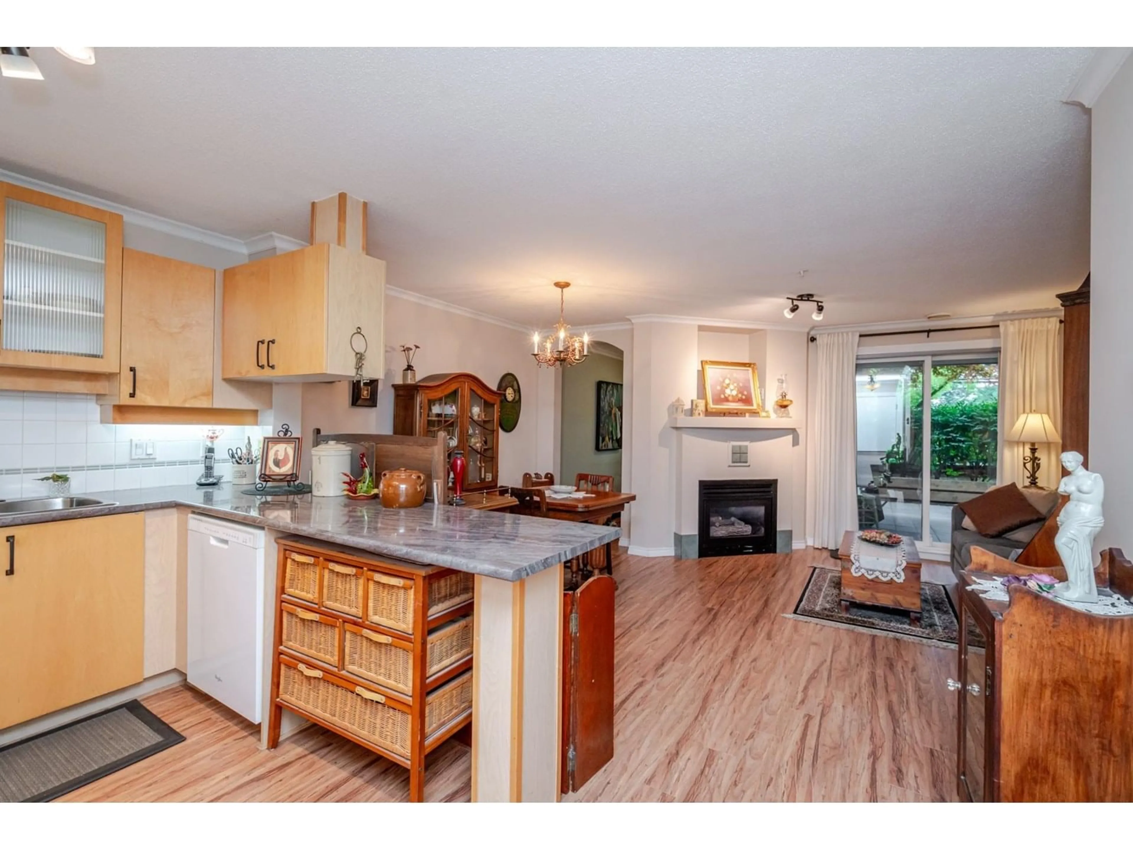 Open concept kitchen, wood/laminate floor for 105 - 19750 64, Langley British Columbia V2Y2T1