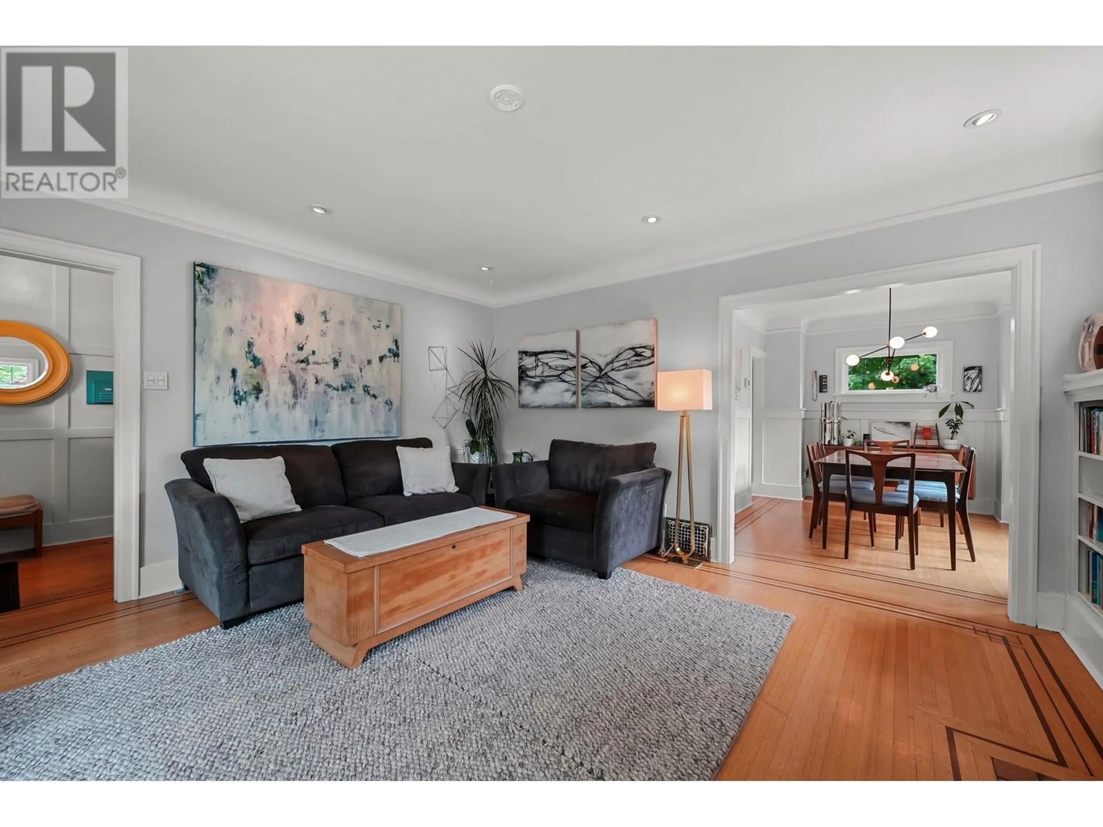 Living room with furniture, wood/laminate floor for 1556 KAMLOOPS STREET, Vancouver British Columbia V5K3W2