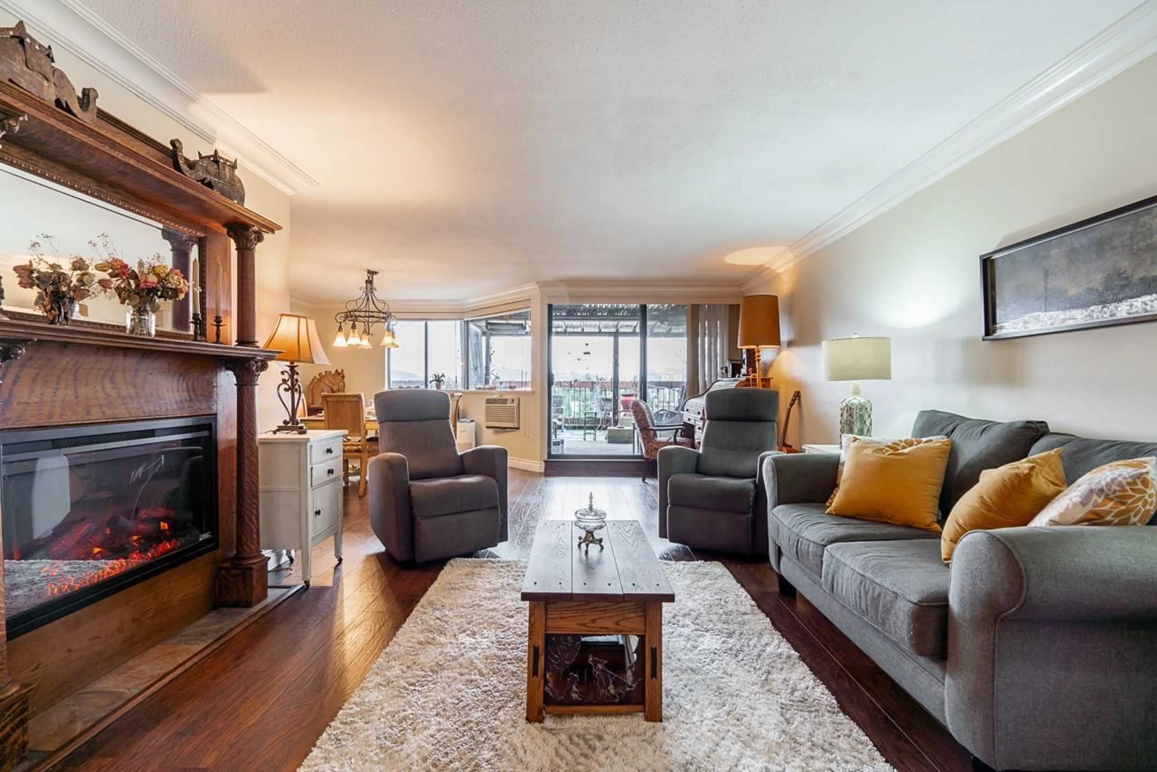 Living room with furniture, wood/laminate floor for 901 - 31955 OLD YALE, Abbotsford British Columbia V2T4N1