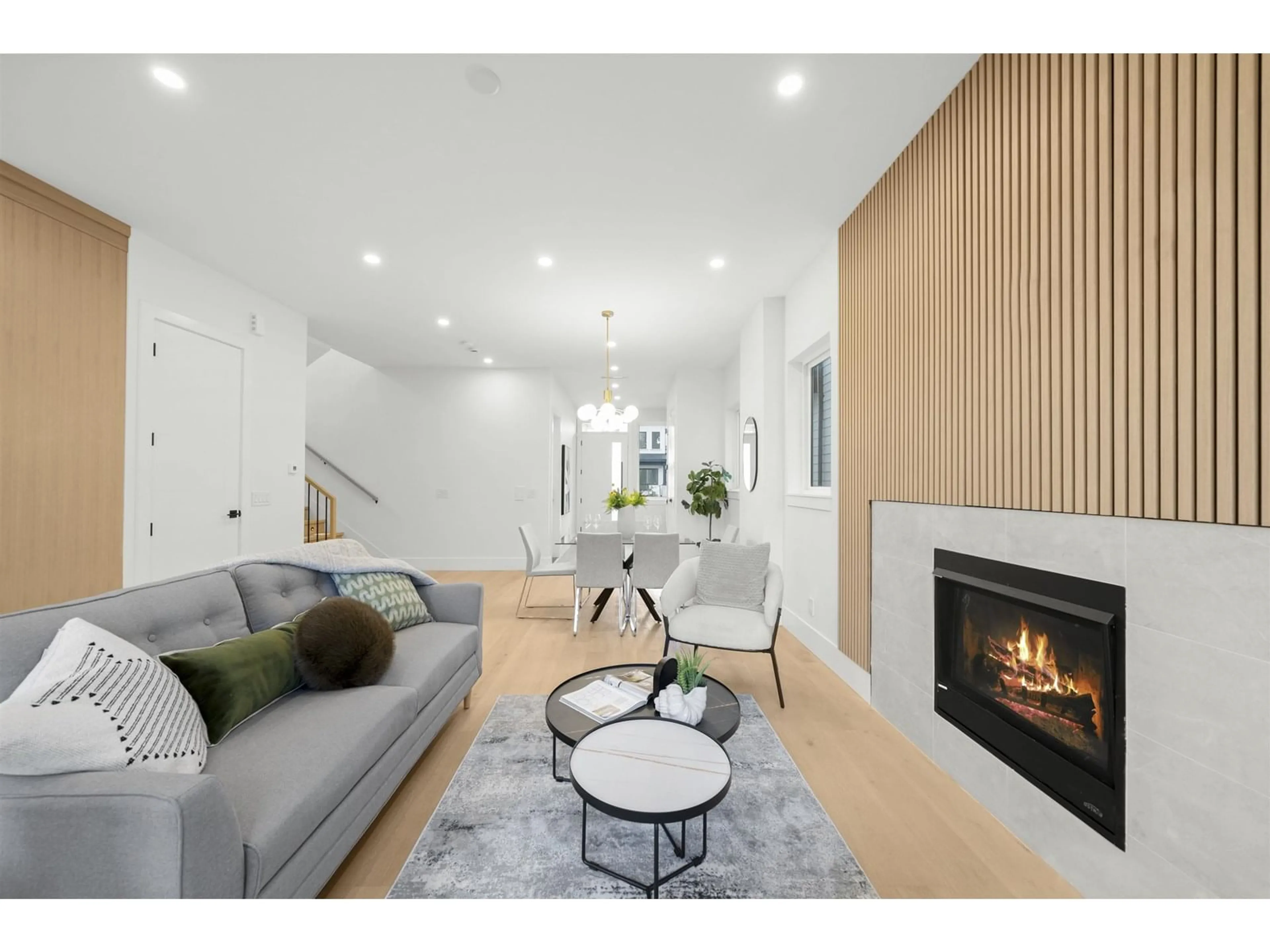 Living room with furniture, wood/laminate floor for 7523 205, Langley British Columbia V2Y3S8