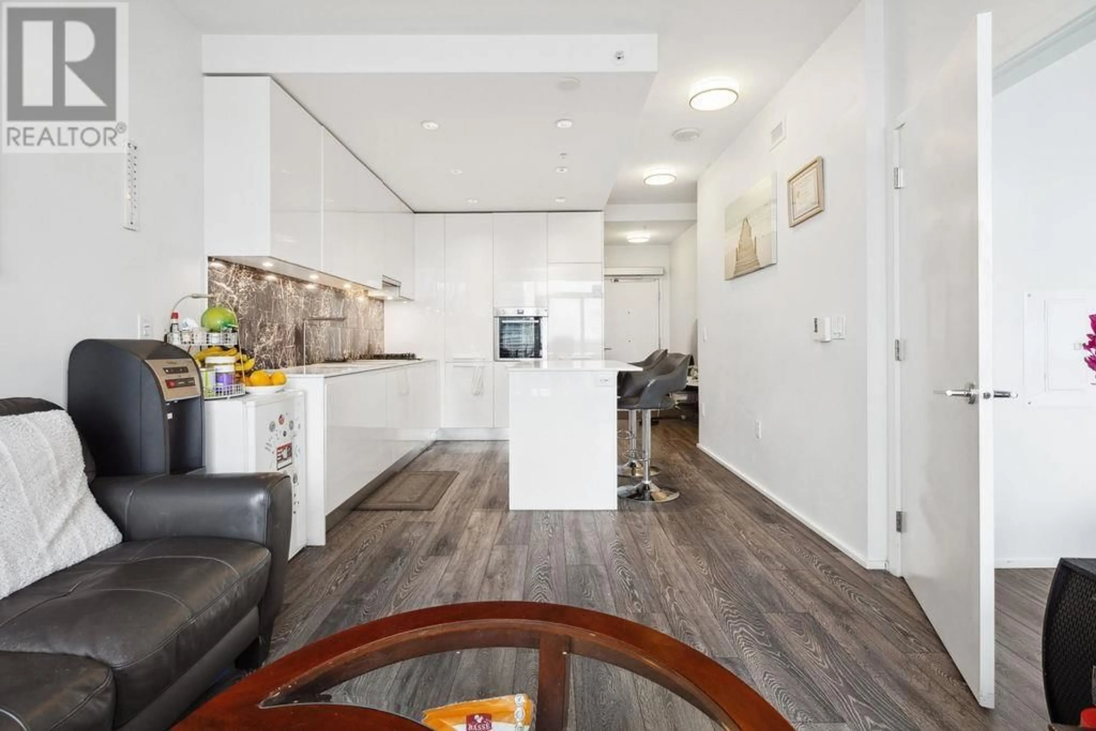 Open concept kitchen, wood/laminate floor for 1508 - 1955 ALPHA WAY, Burnaby British Columbia V5C0K6