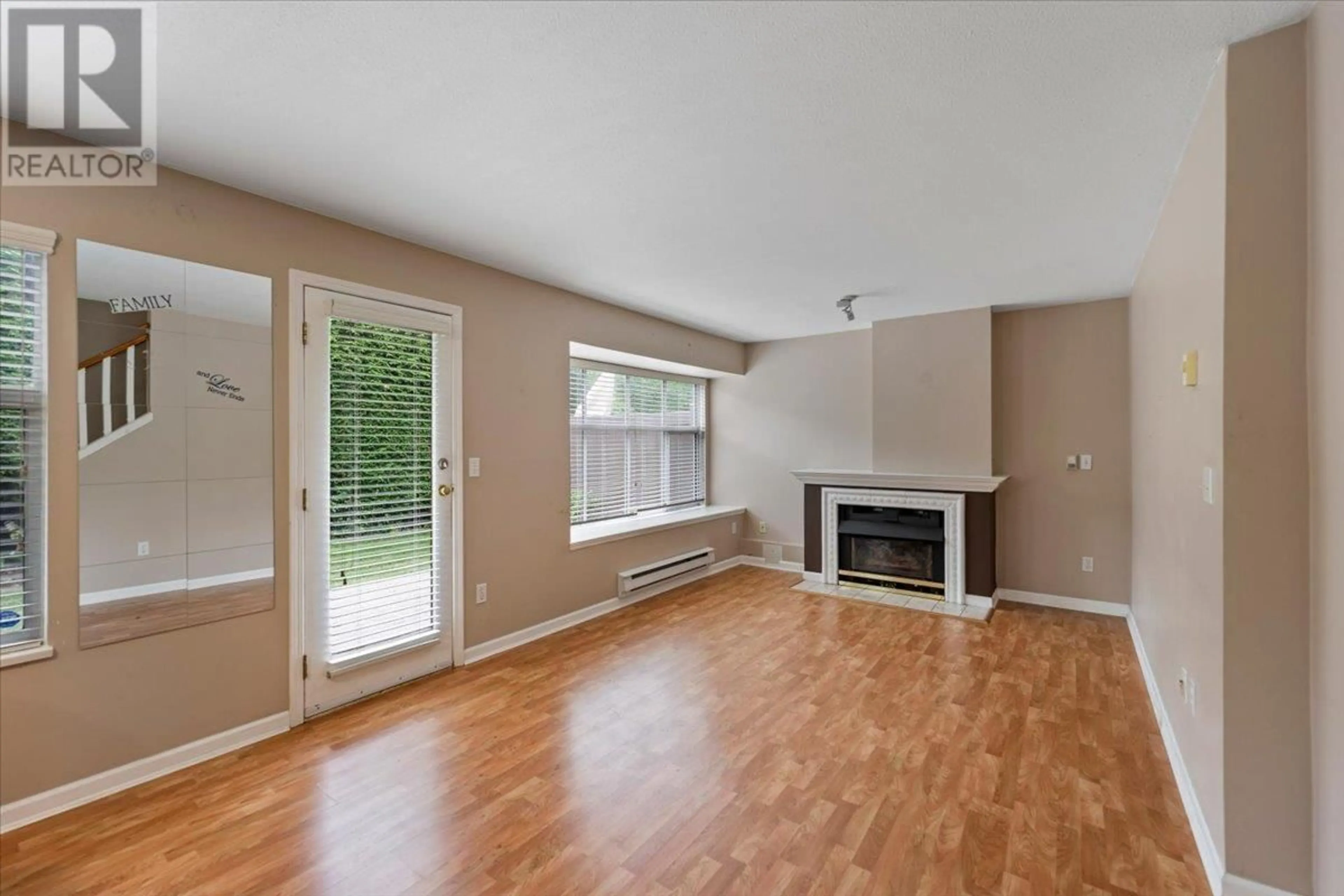 Living room with furniture, wood/laminate floor for 110 - 12099 237 STREET, Maple Ridge British Columbia V4R2C3