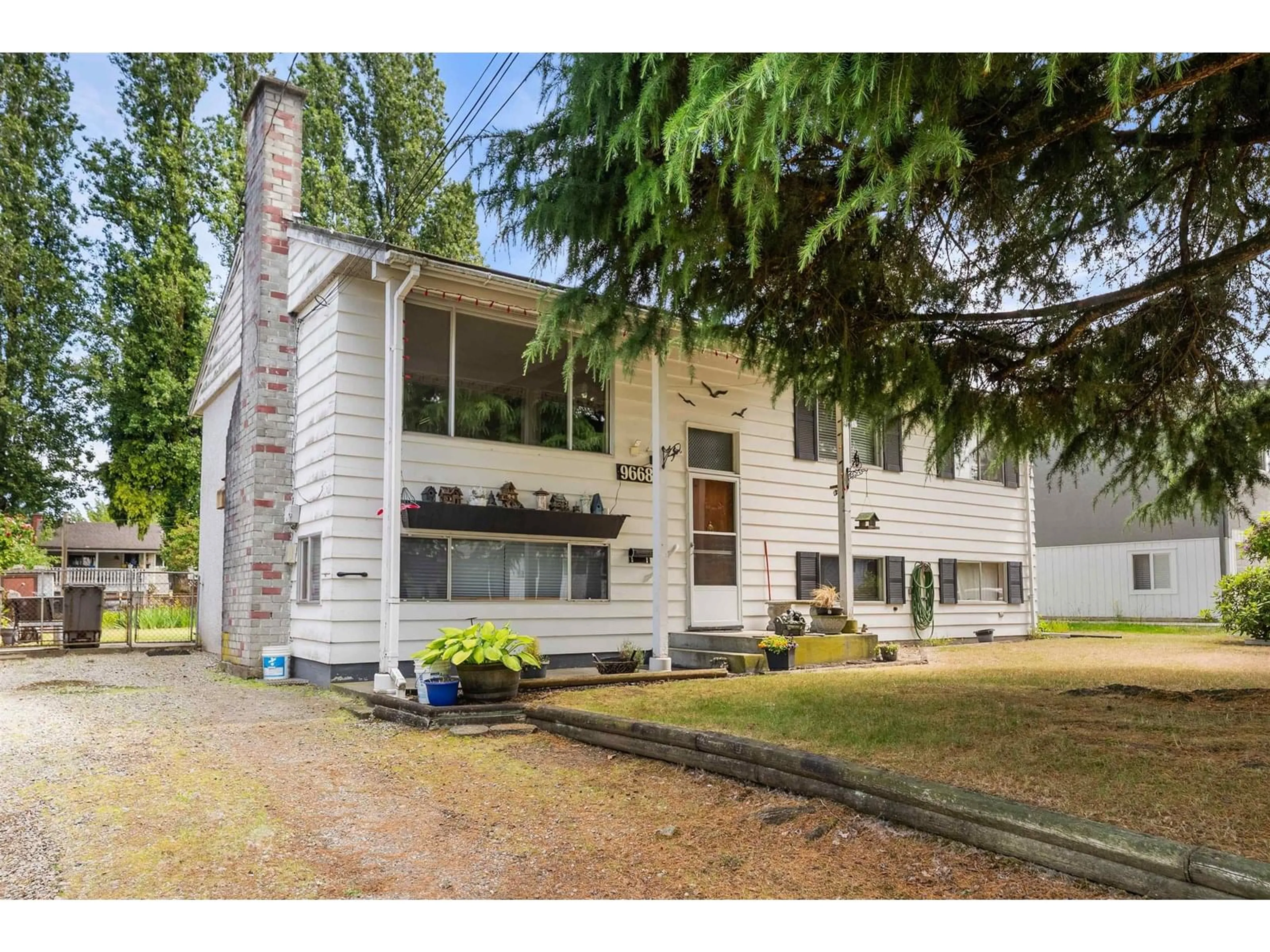 Home with vinyl exterior material, street for 9668 124A, Surrey British Columbia V3V4W1