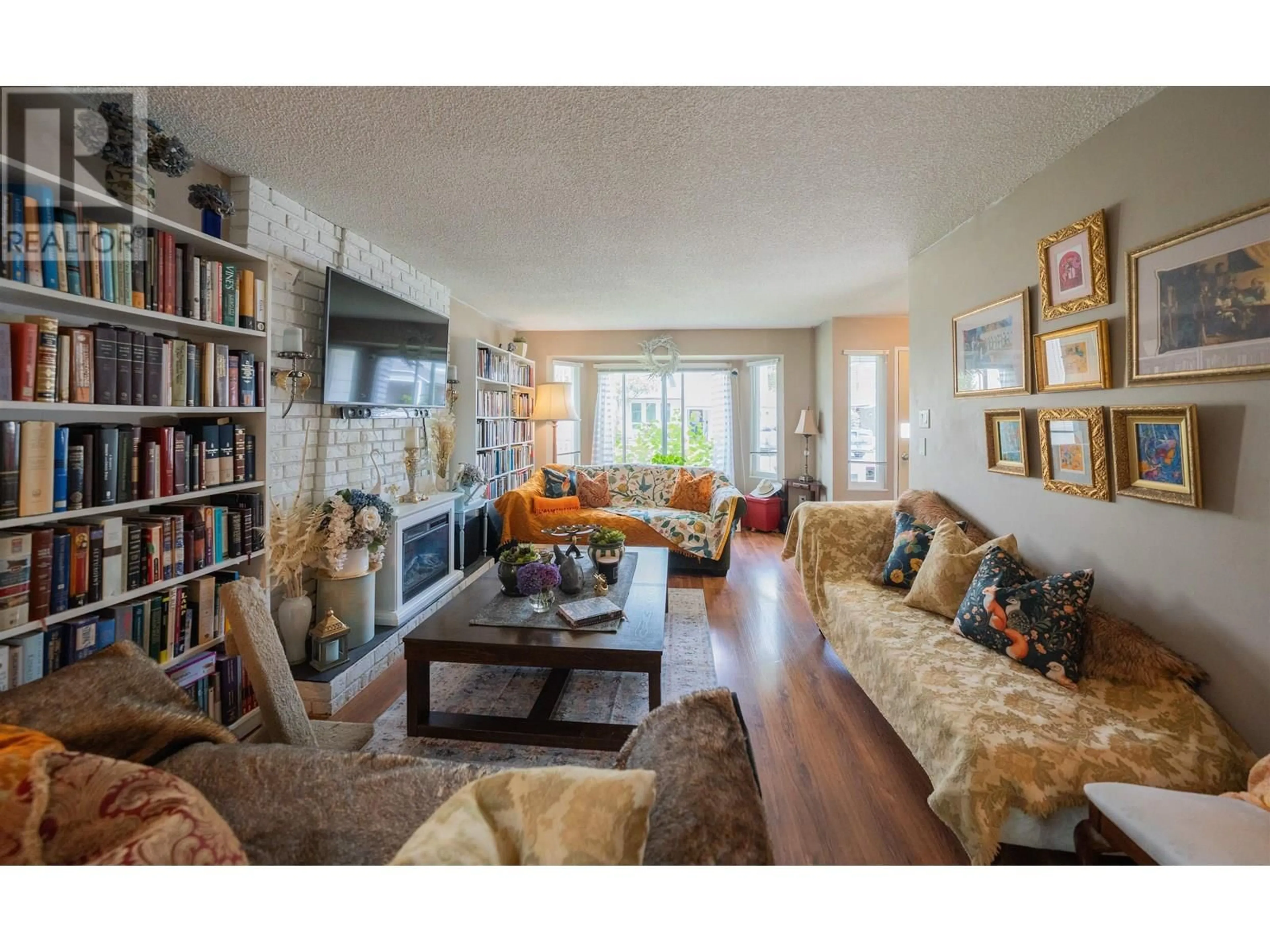 Living room with furniture, wood/laminate floor for 1237 RIVER DRIVE, Coquitlam British Columbia V3E1N7