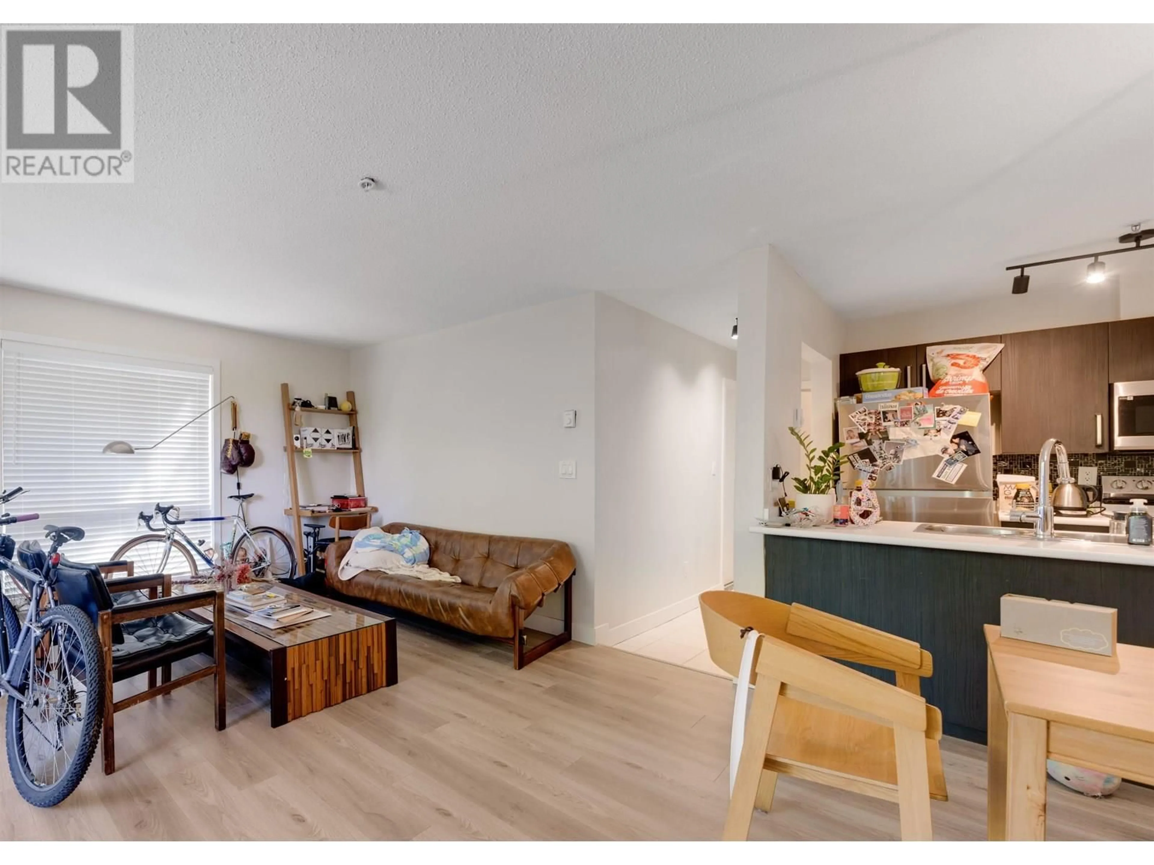 Living room with furniture, wood/laminate floor for 104 - 1166 6TH AVENUE, Vancouver British Columbia V6H1A4