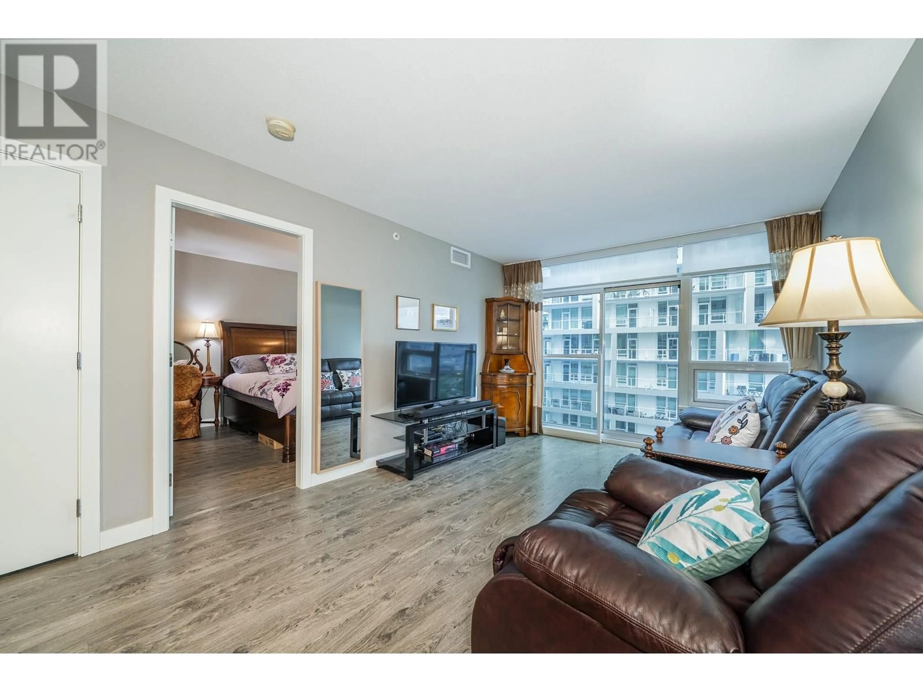 Living room with furniture, wood/laminate floor for 859 - 6288 NO. 3 ROAD, Richmond British Columbia V6Y0J4