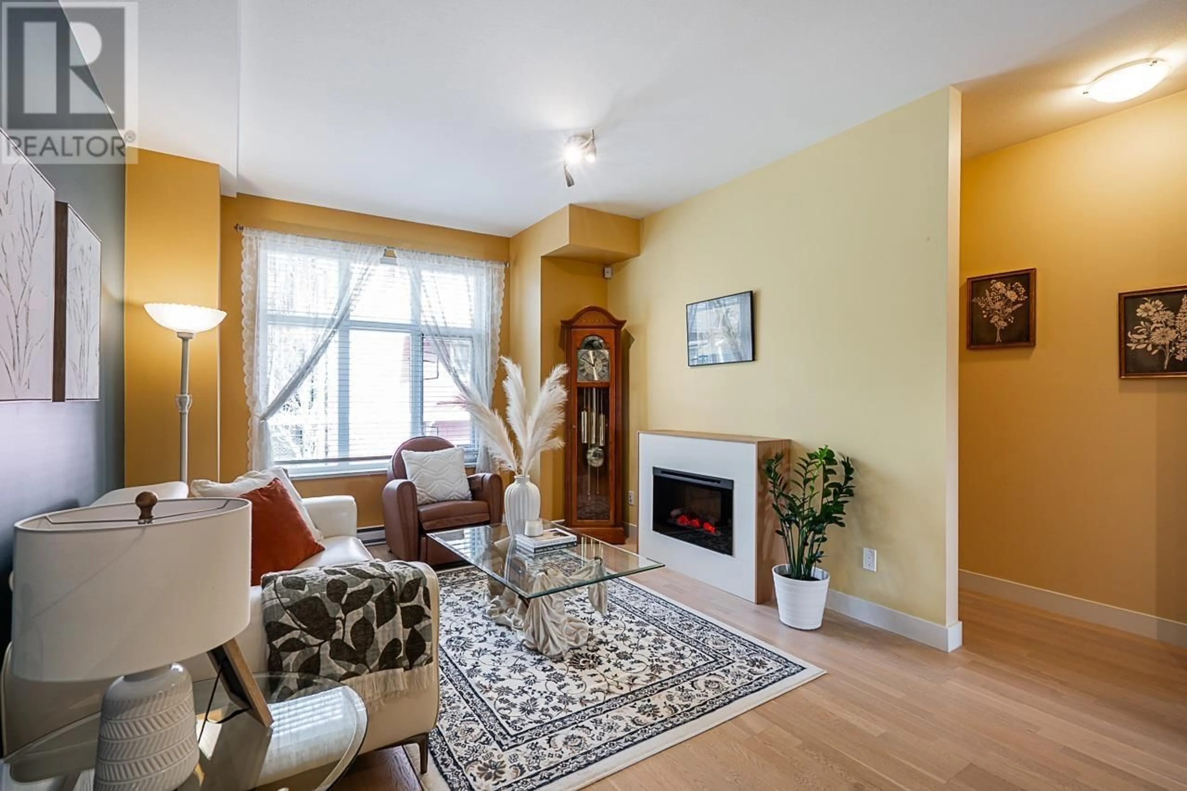 Living room with furniture, wood/laminate floor for 1103 - 8485 NEW HAVEN CLOSE, Burnaby British Columbia V5J0B7