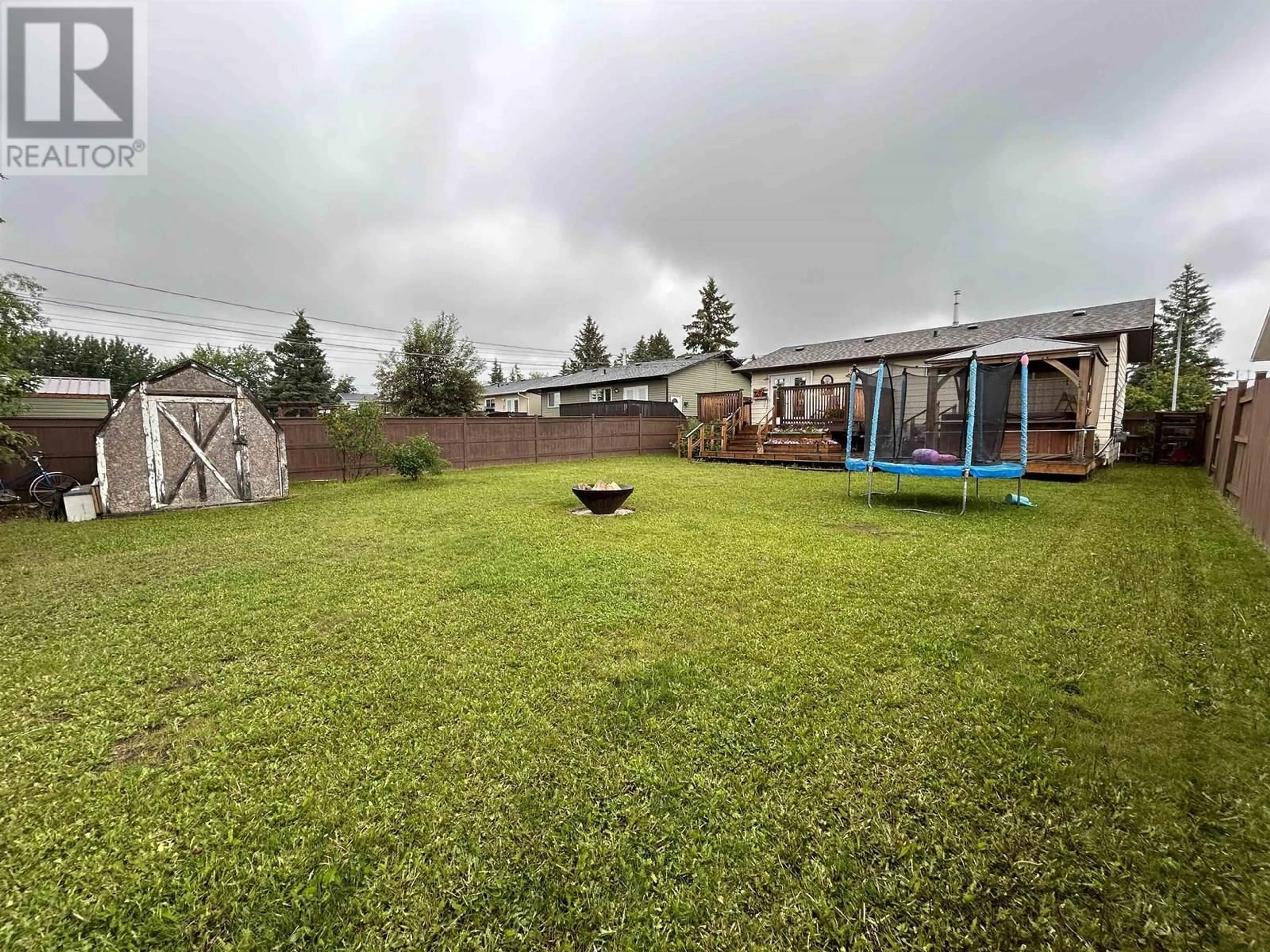 A pic from outside/outdoor area/front of a property/back of a property/a pic from drone, unknown for 8720 88 STREET, Fort St. John British Columbia V1J5A9