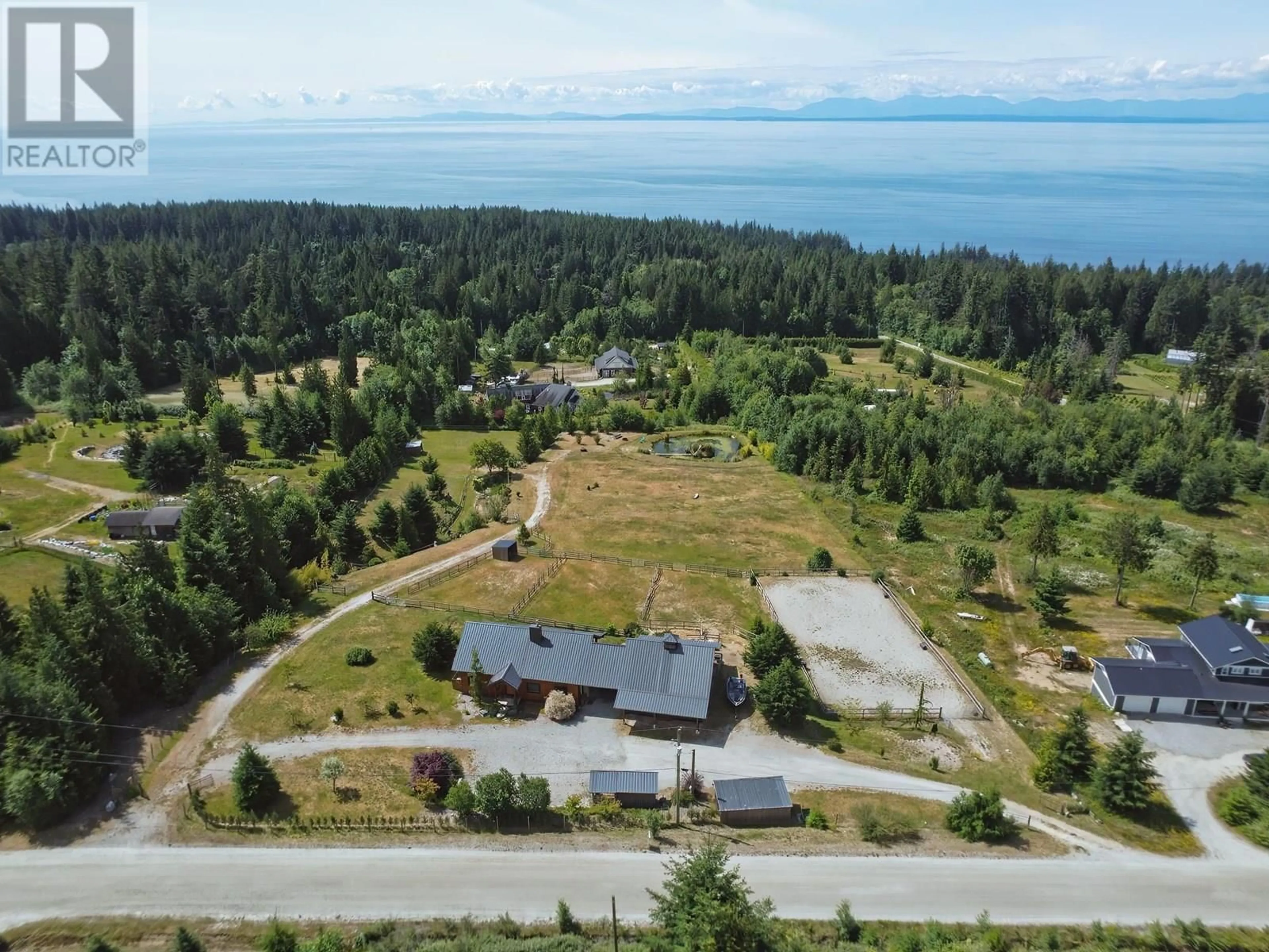 A pic from outside/outdoor area/front of a property/back of a property/a pic from drone, water/lake/river/ocean view for 2247 PIXTON ROAD, Roberts Creek British Columbia V0N2W5