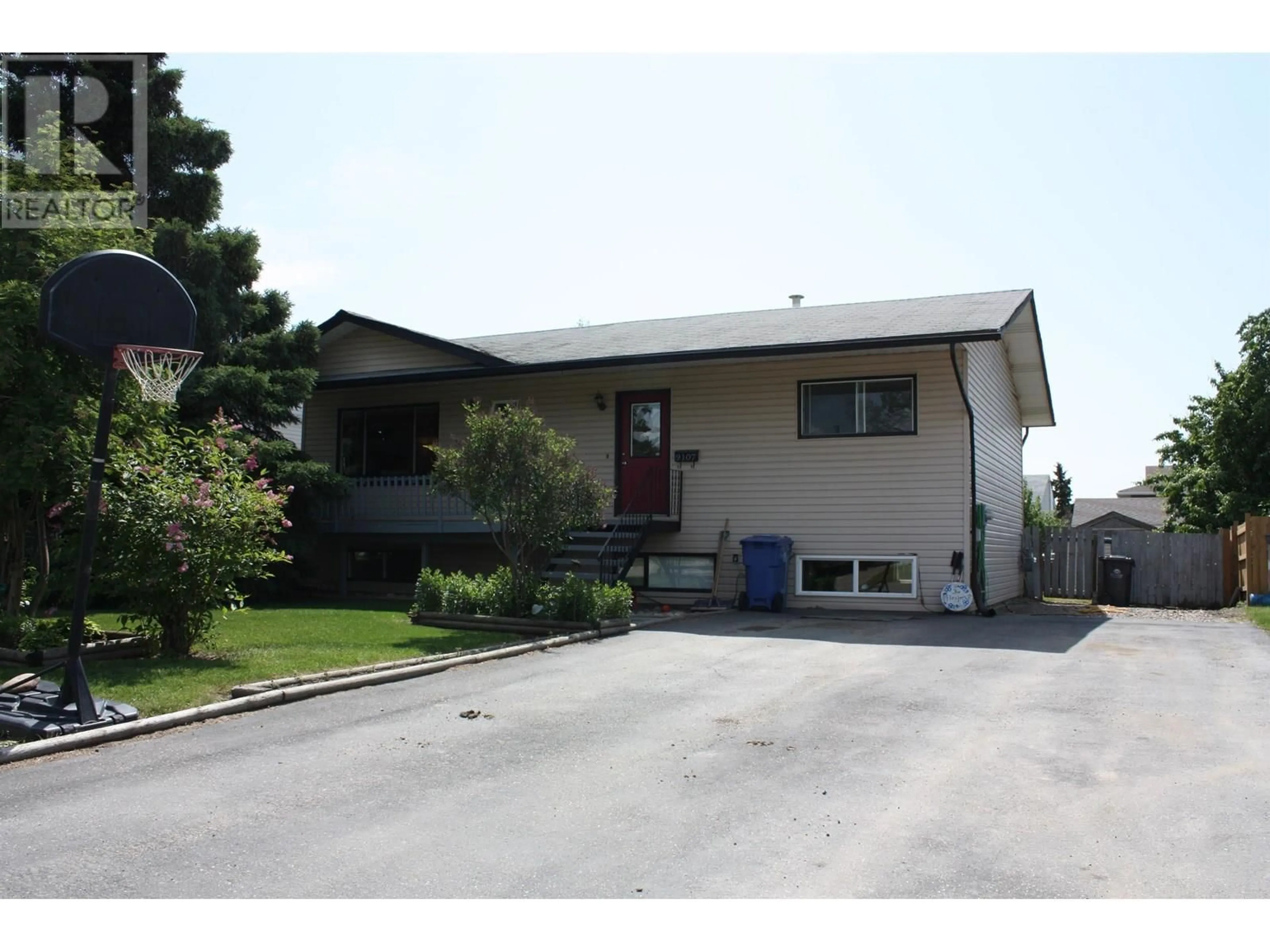 Home with vinyl exterior material, street for 9107 99 AVENUE, Fort St. John British Columbia V1J5S3