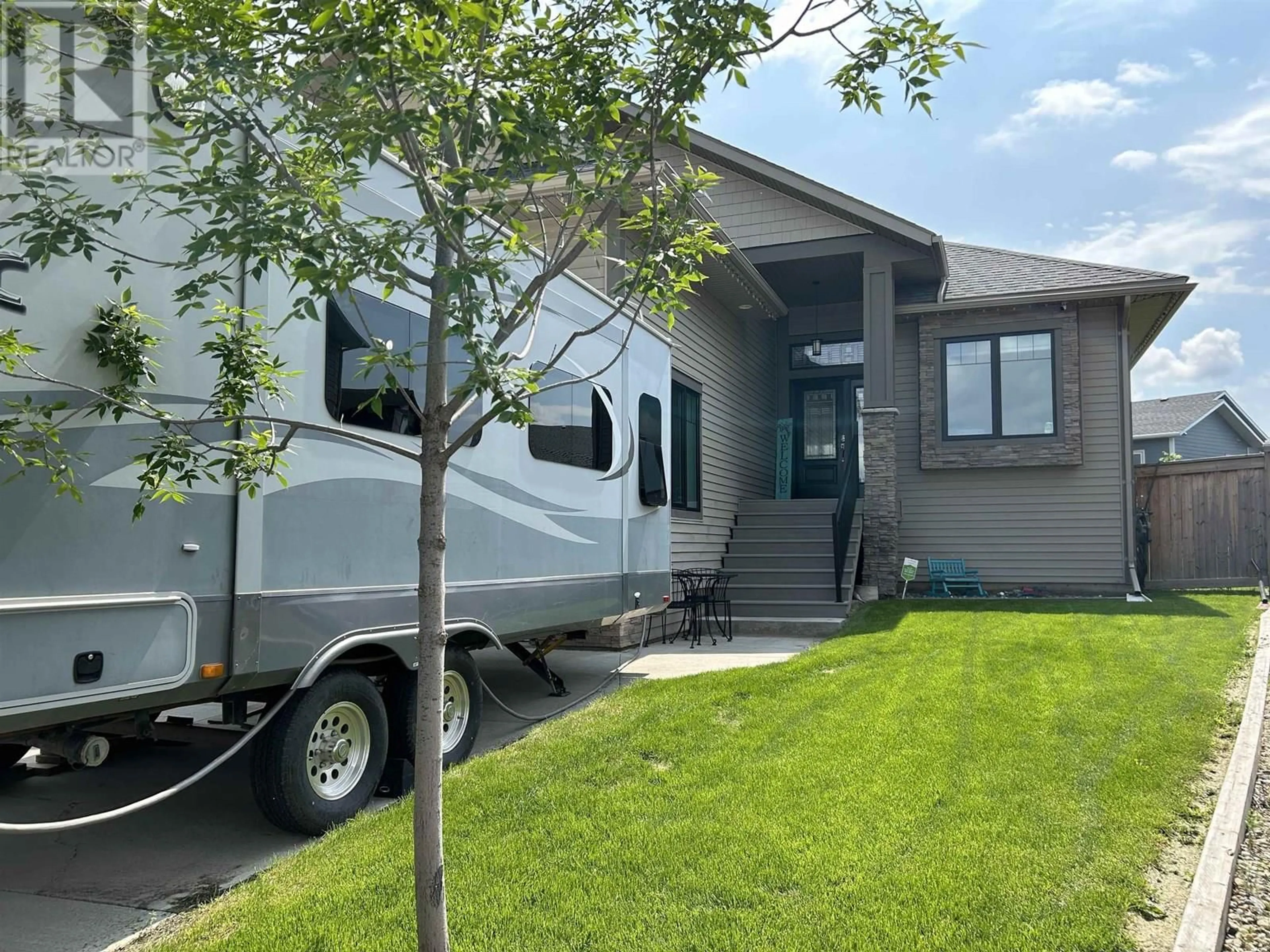 Home with vinyl exterior material, street for 11707 102A STREET, Fort St. John British Columbia V1J0K4