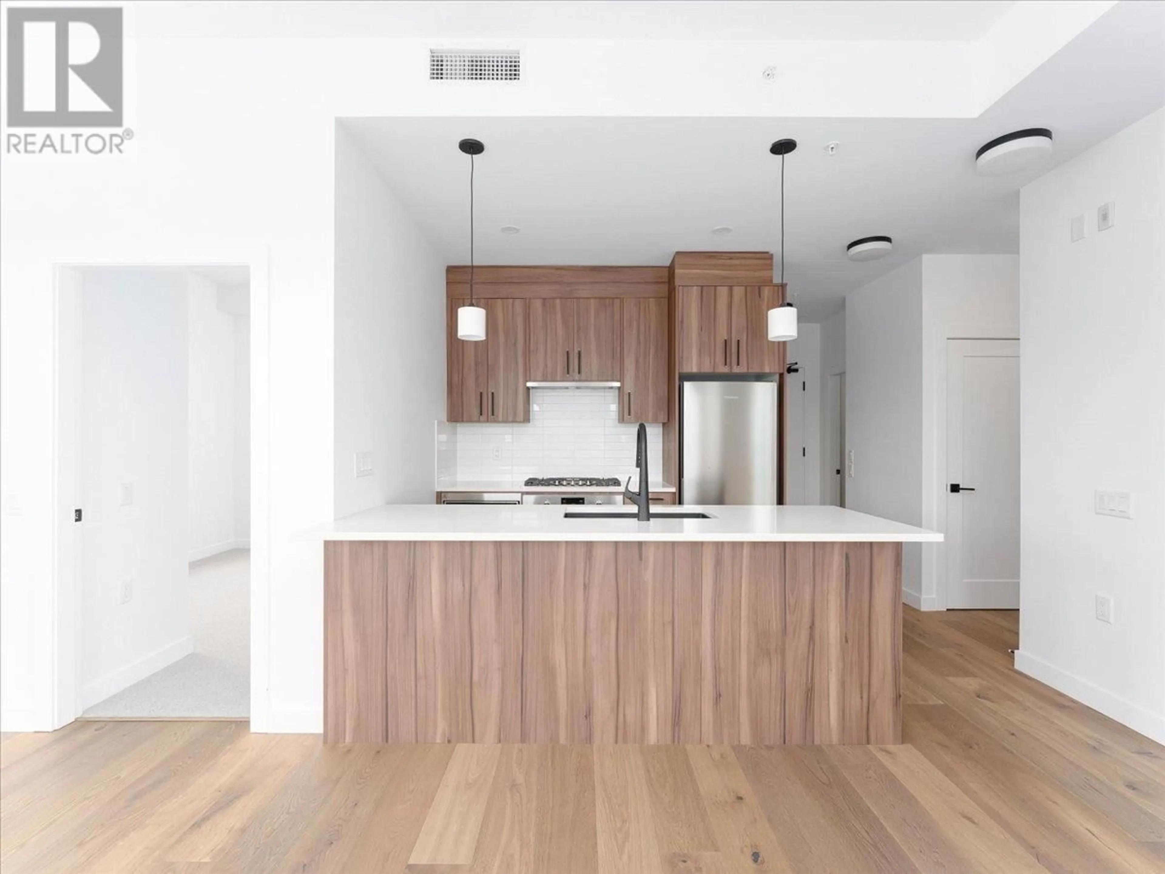 Open concept kitchen, wood/laminate floor for 503 - 6859 CAMBIE STREET, Vancouver British Columbia V6P3H1