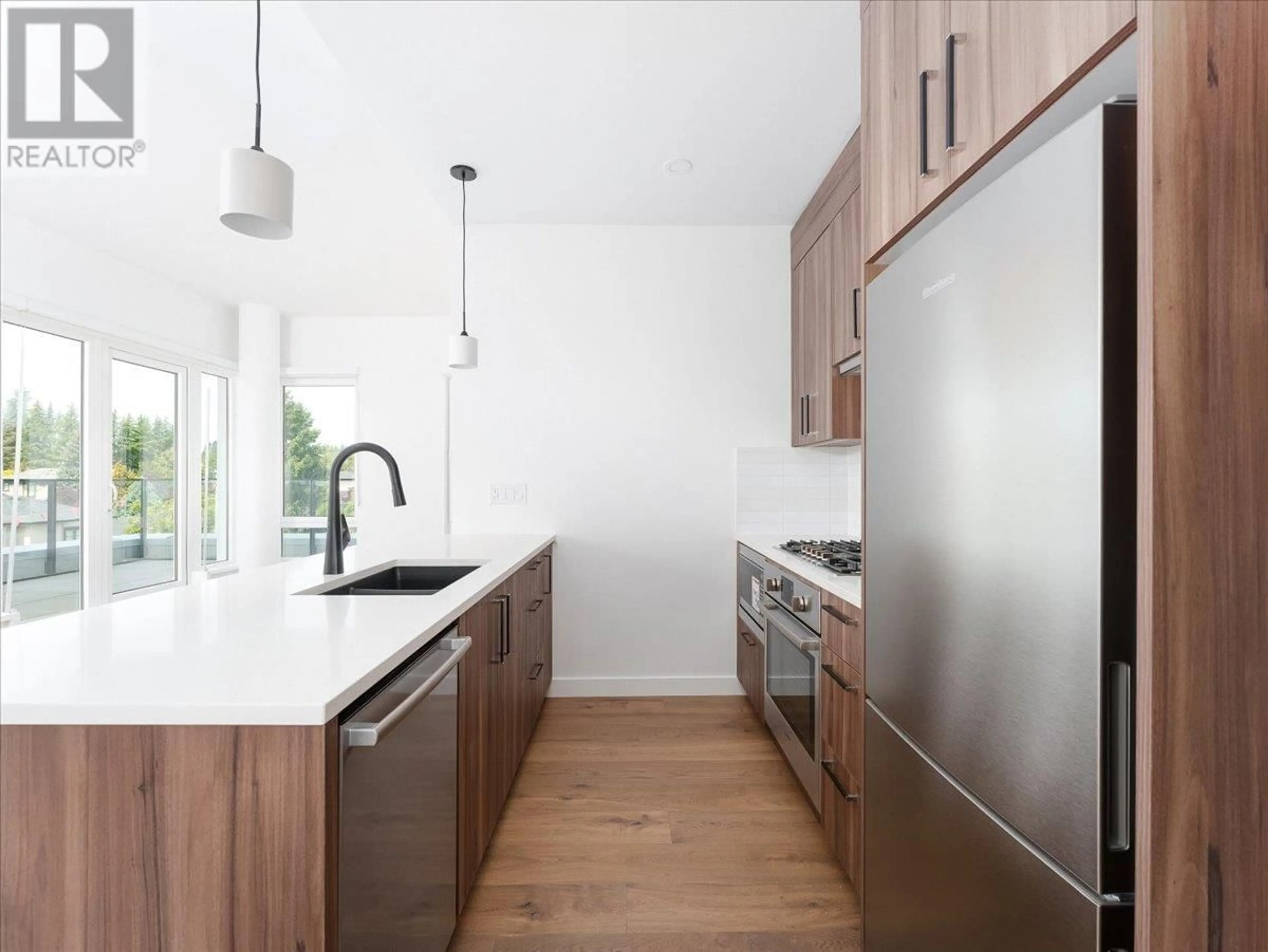 Contemporary kitchen, wood/laminate floor for 503 - 6859 CAMBIE STREET, Vancouver British Columbia V6P3H1