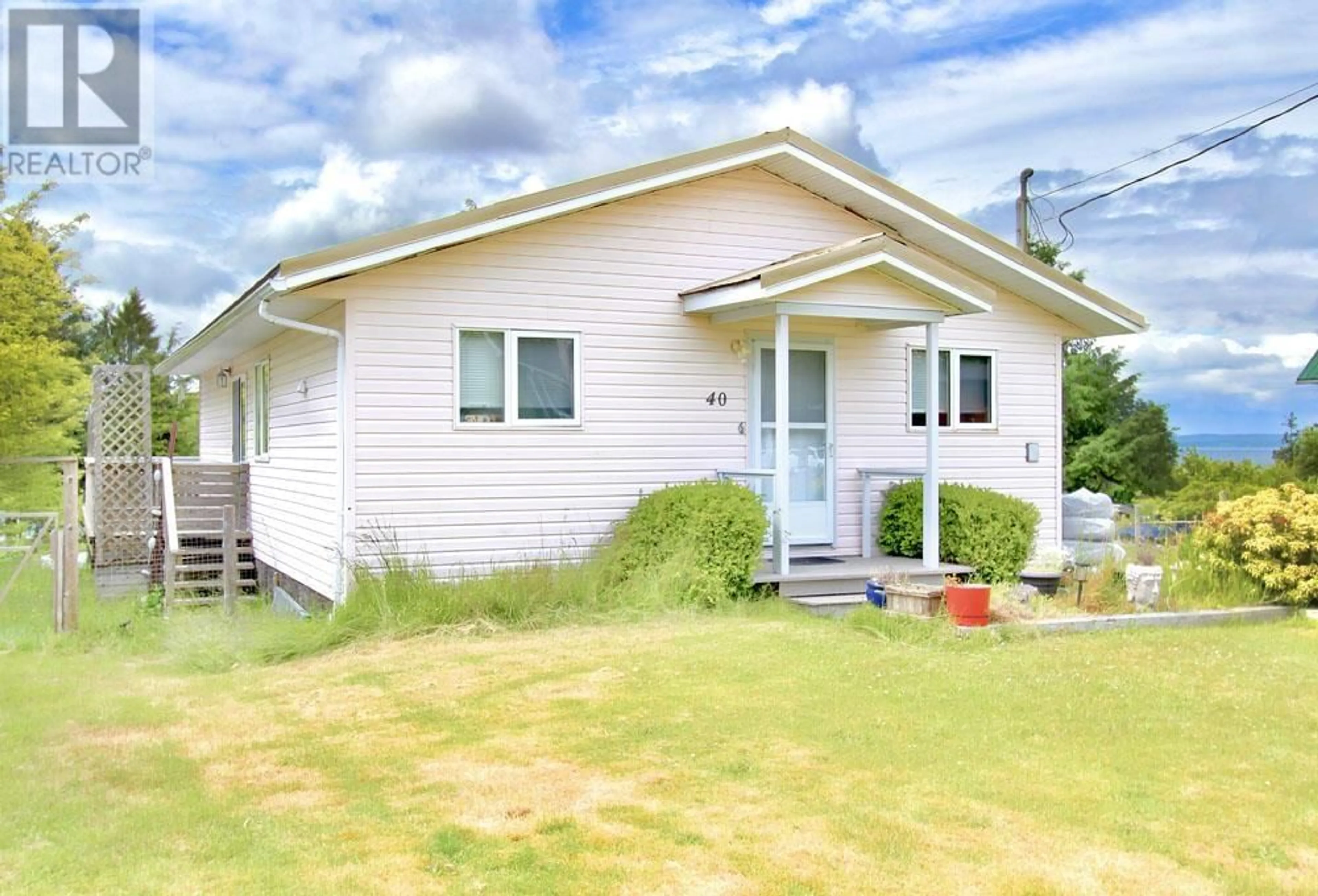Home with vinyl exterior material, street for 40 YAKOUN STREET, Port Clements British Columbia V0T1R0