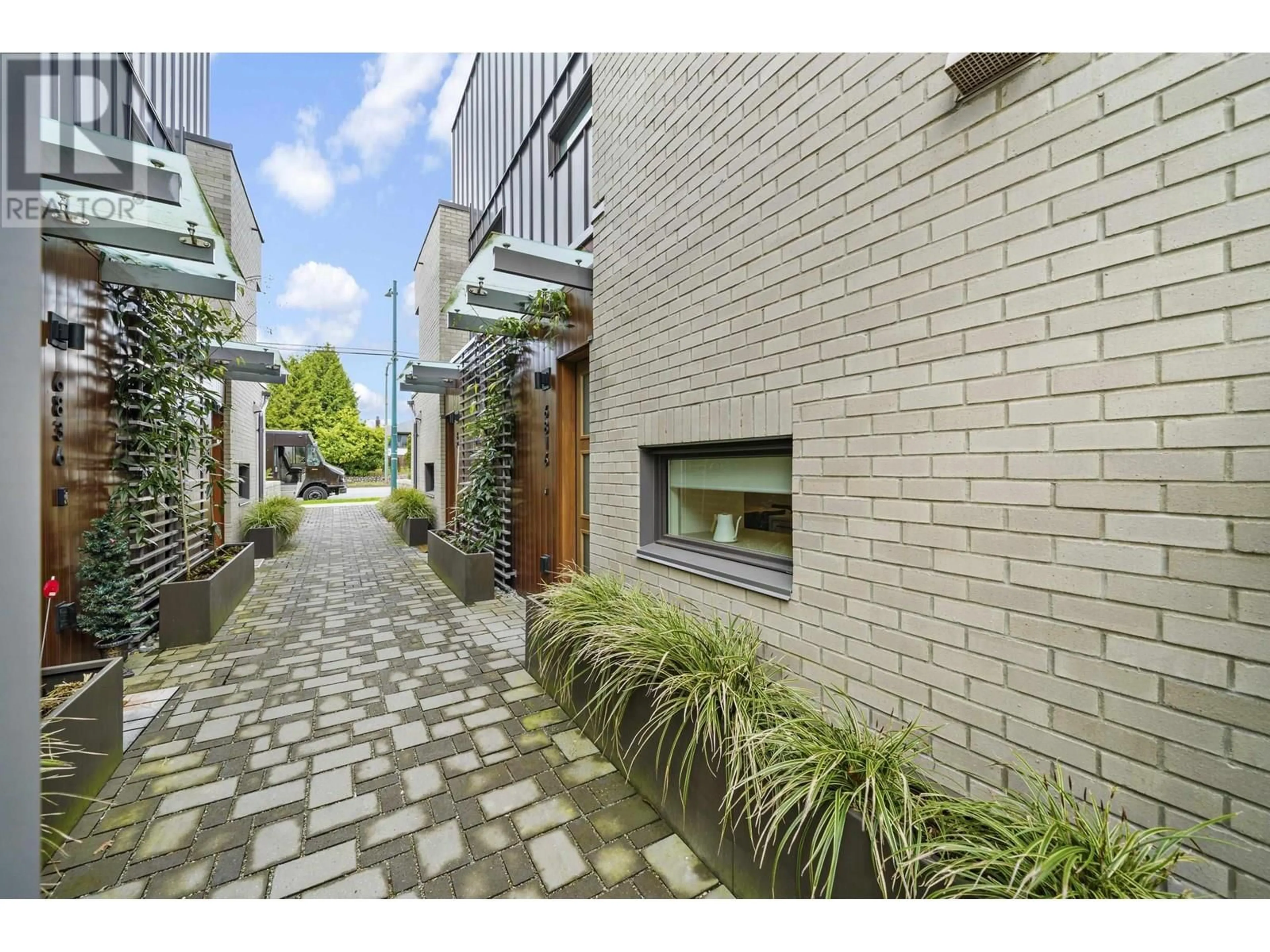 Home with brick exterior material, street for 6816 OAK STREET, Vancouver British Columbia V6P0K7