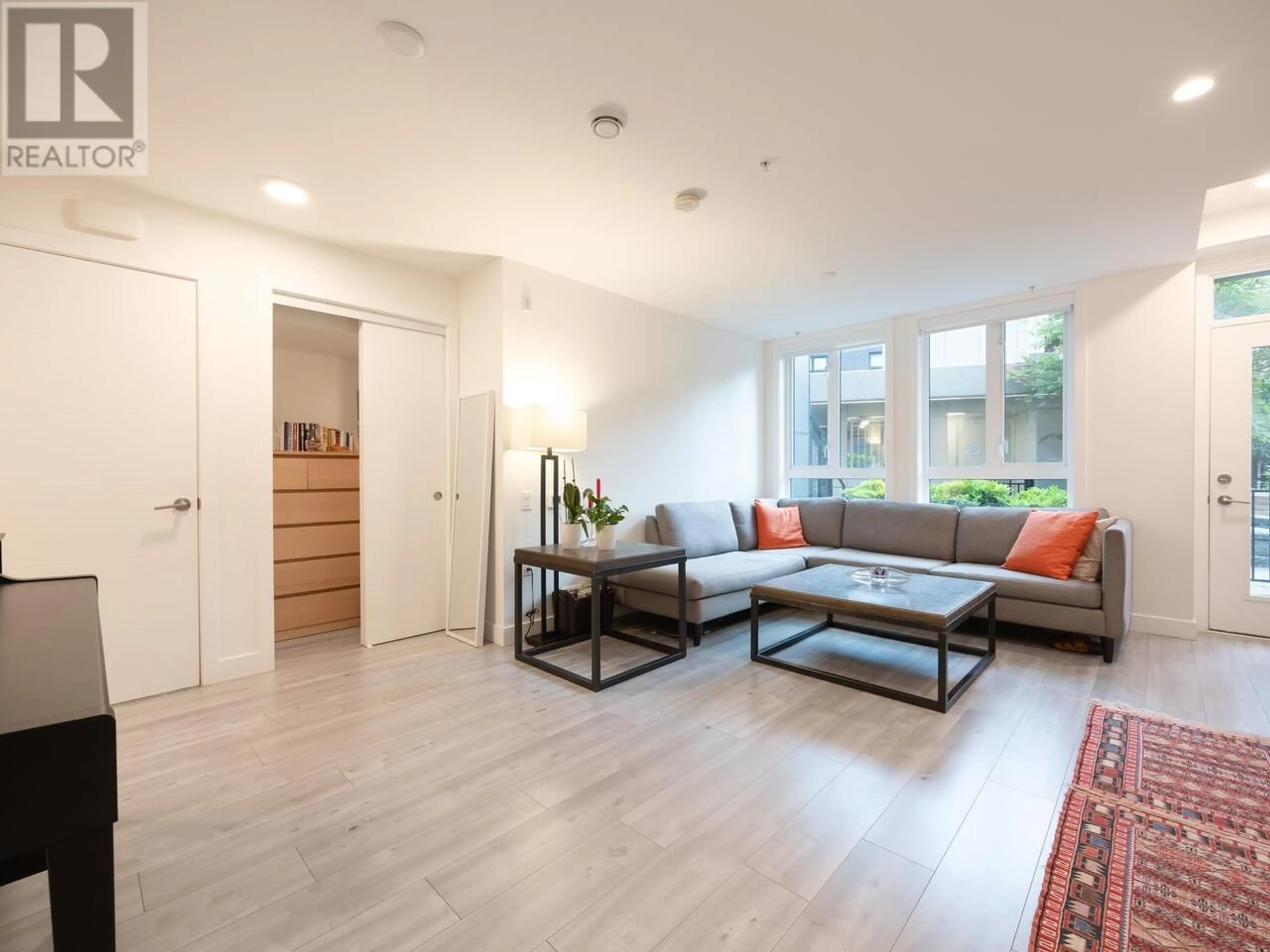 Living room with furniture, wood/laminate floor for 124 - 2035 GLENAIRE DRIVE, North Vancouver British Columbia V7P1Y2