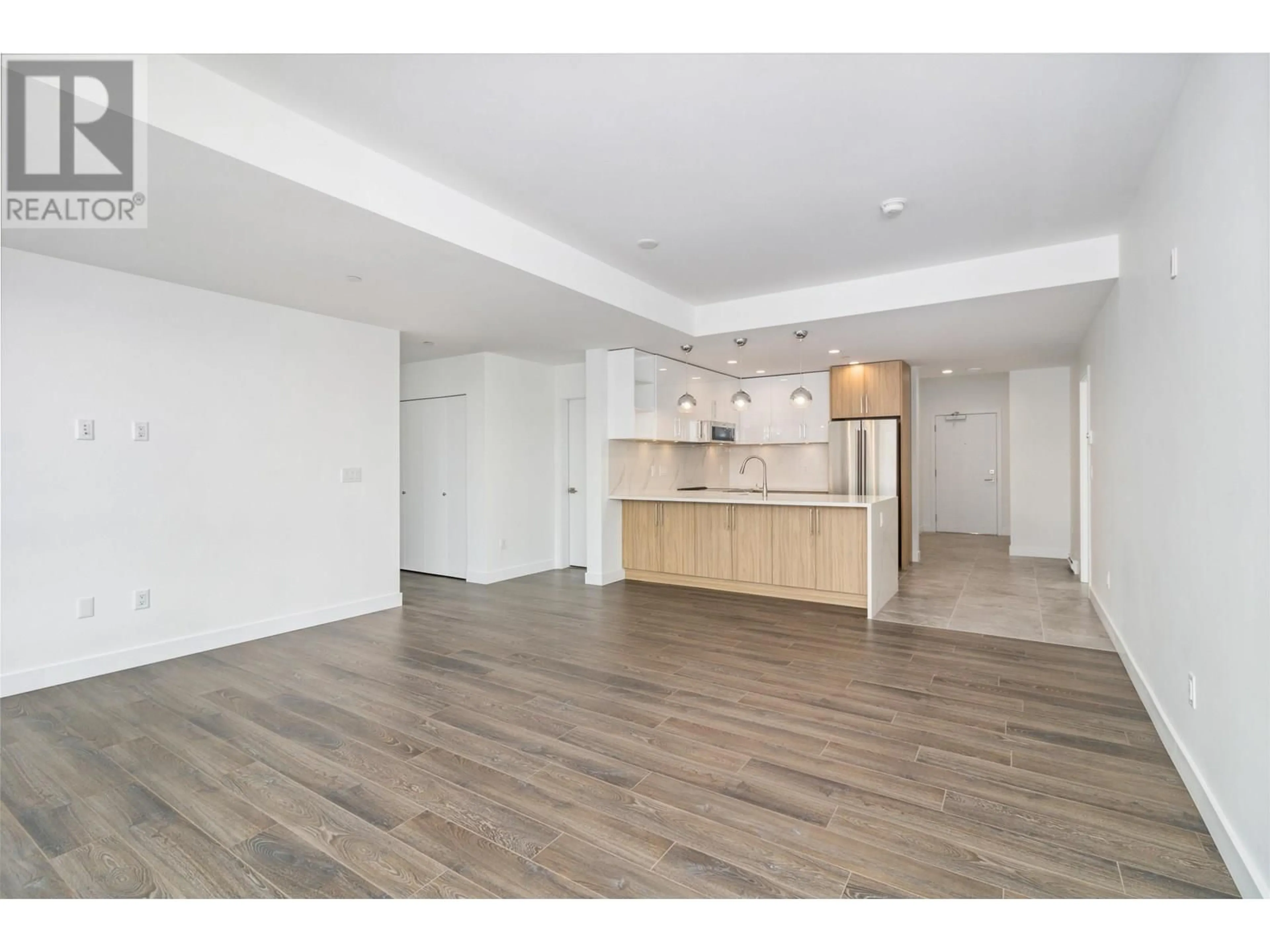 Open concept kitchen, wood/laminate floor for 509 - 11703 FRASER STREET, Maple Ridge British Columbia V2X9A7