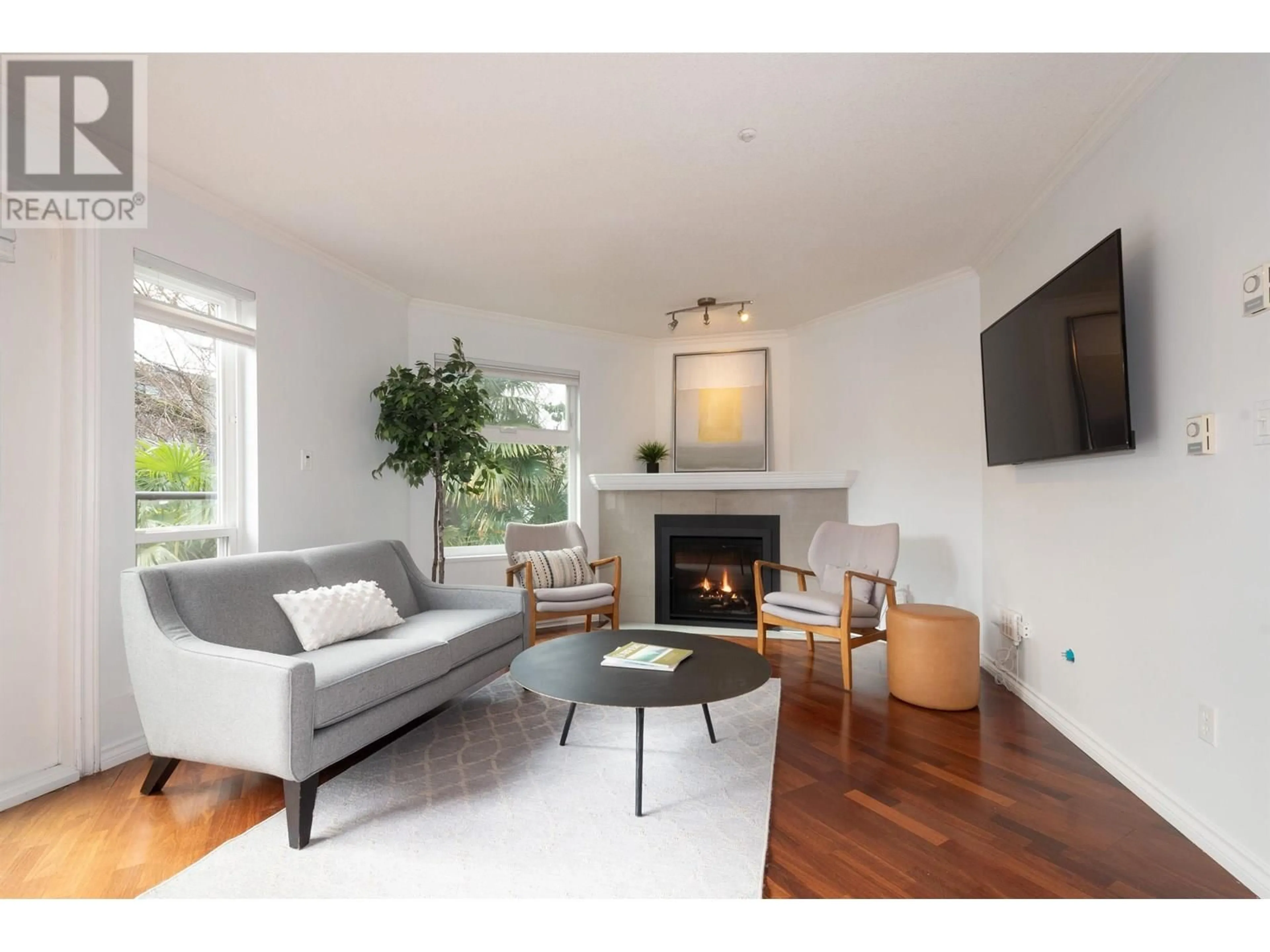 Living room with furniture, wood/laminate floor for 202 - 1959 2ND AVENUE, Vancouver British Columbia V6J1J2