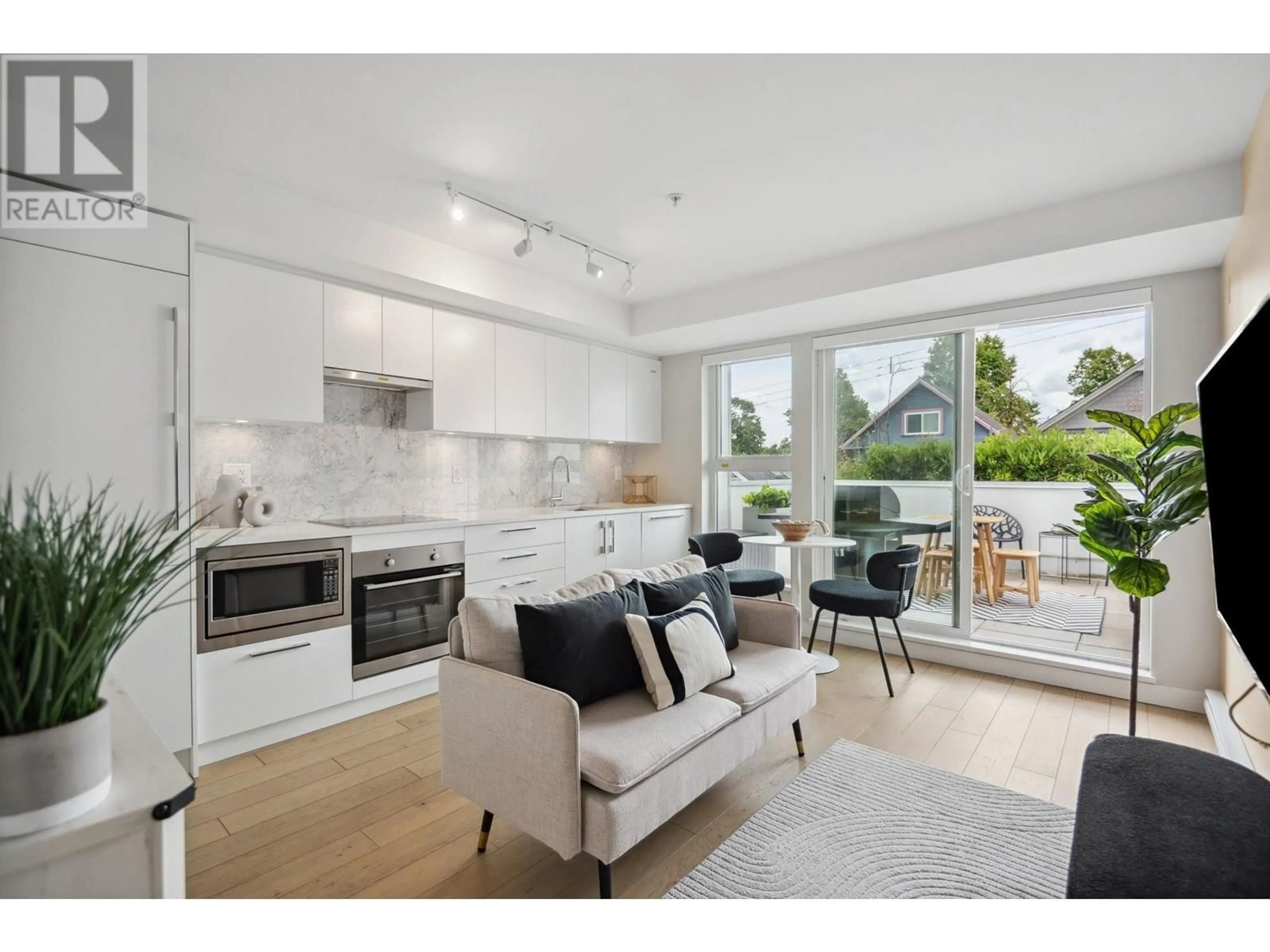 Open concept kitchen, unknown for 208 - 2508 FRASER STREET, Vancouver British Columbia V5T3V4