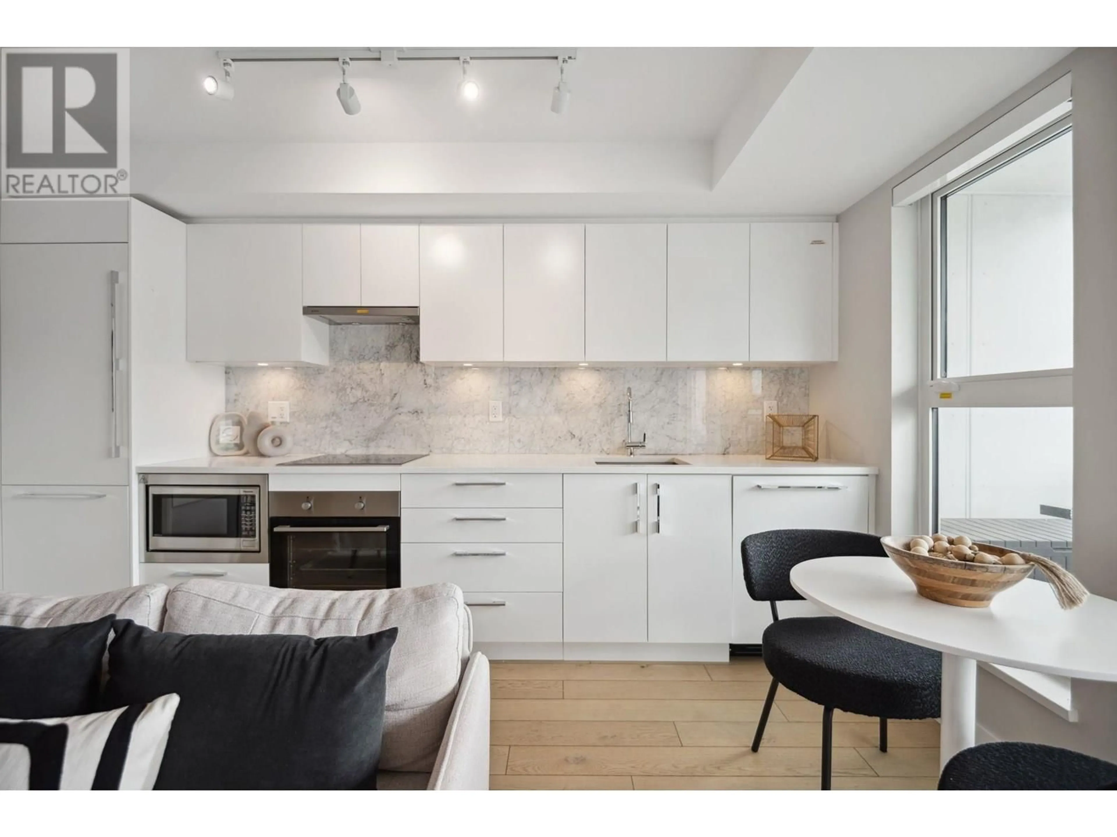 Open concept kitchen, unknown for 208 - 2508 FRASER STREET, Vancouver British Columbia V5T3V4