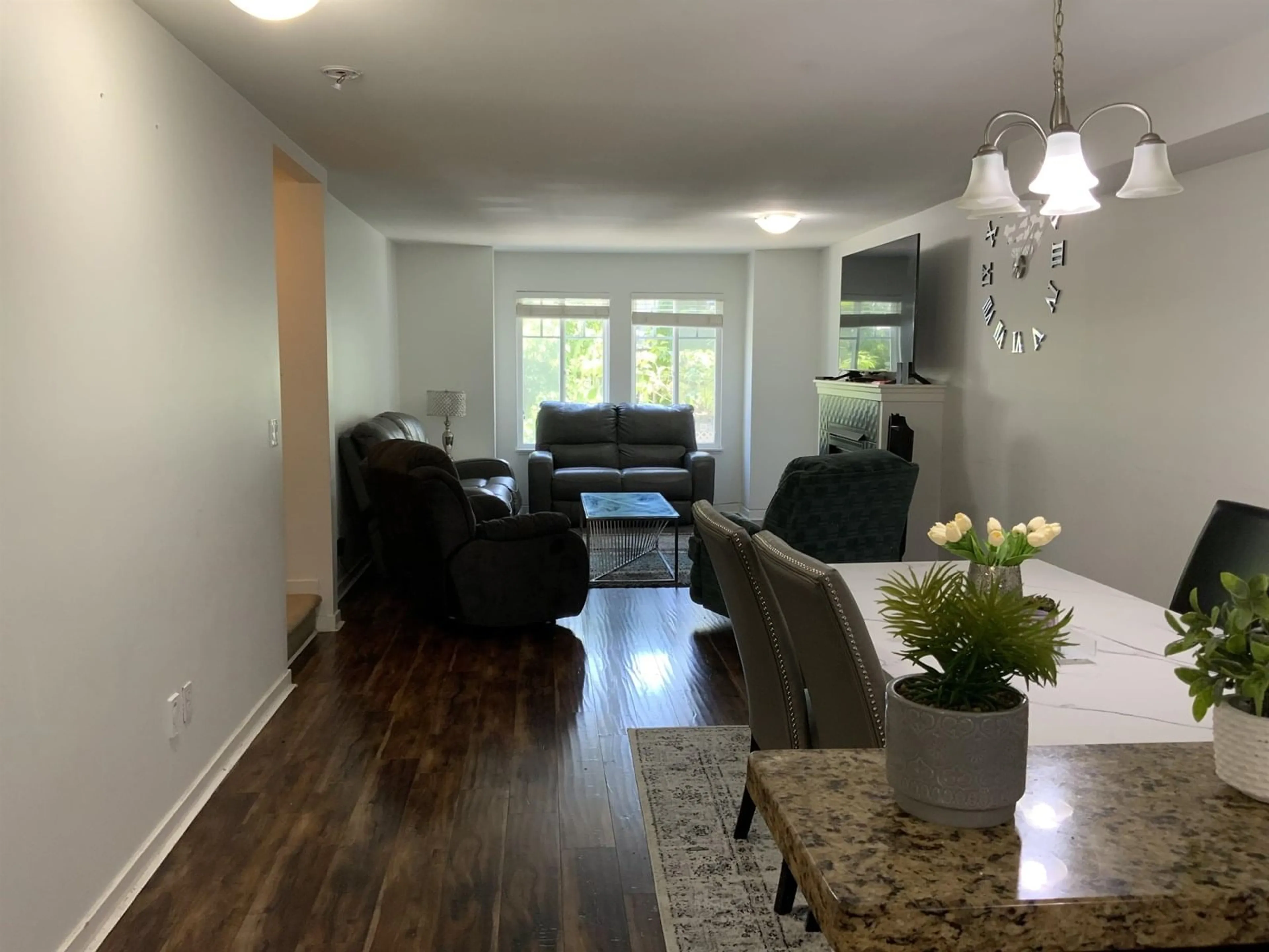 Living room with furniture, wood/laminate floor for 96 - 12711 64, Surrey British Columbia V3W1X1