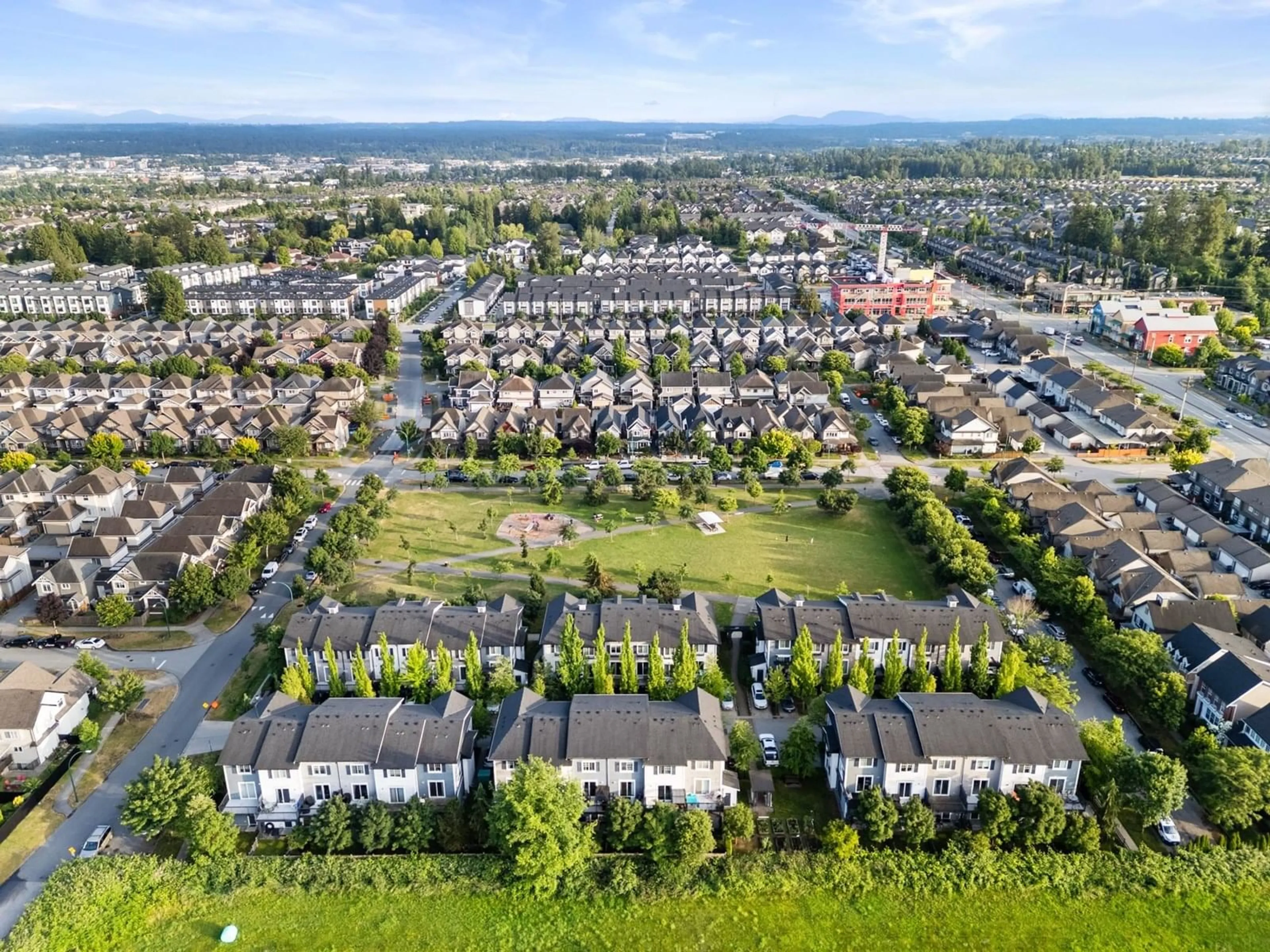 A pic from outside/outdoor area/front of a property/back of a property/a pic from drone, street for 10 - 7348 192A, Surrey British Columbia V4N6J2