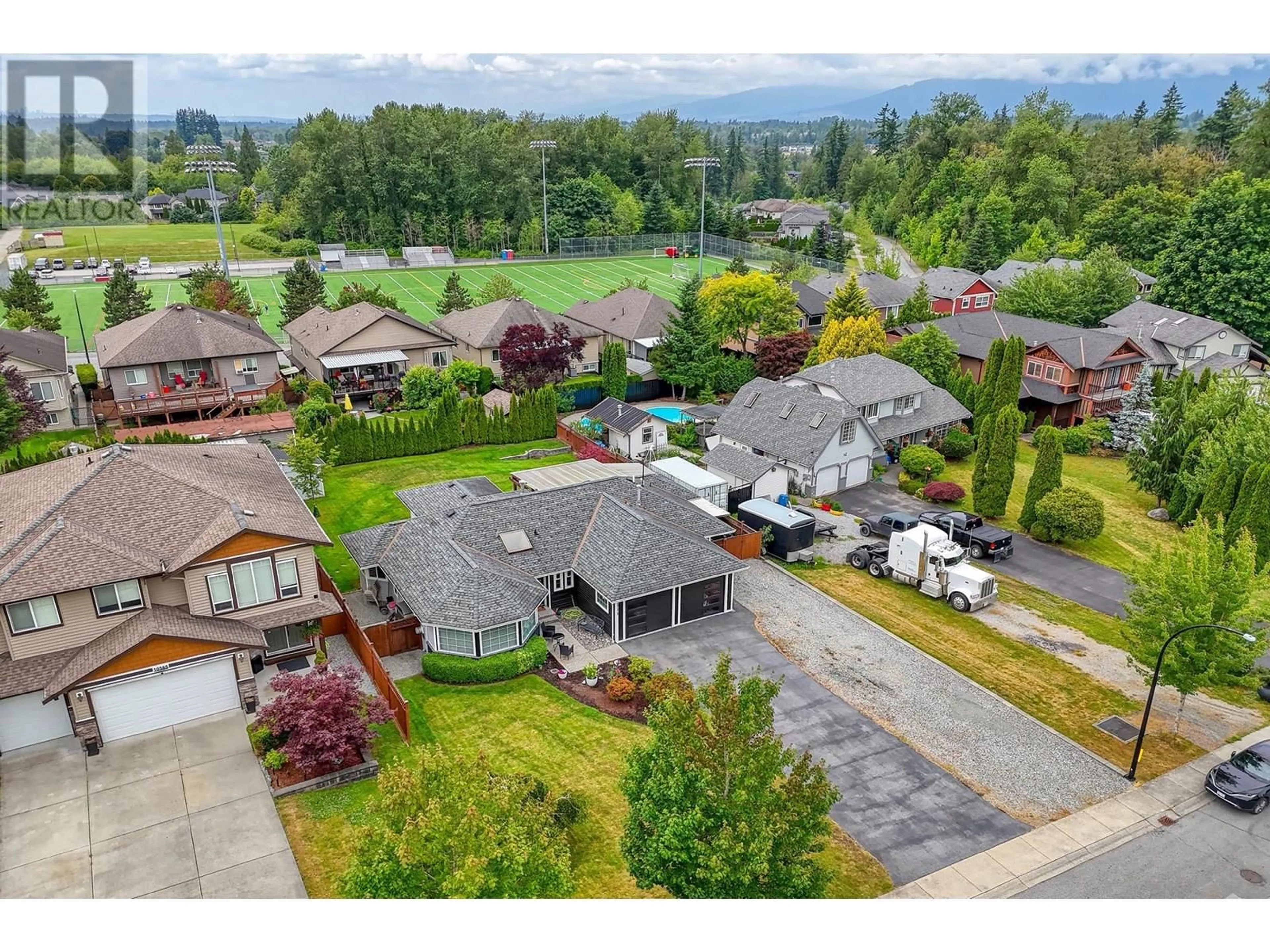 A pic from outside/outdoor area/front of a property/back of a property/a pic from drone, mountain view for 10579 245B STREET, Maple Ridge British Columbia V2W1G5