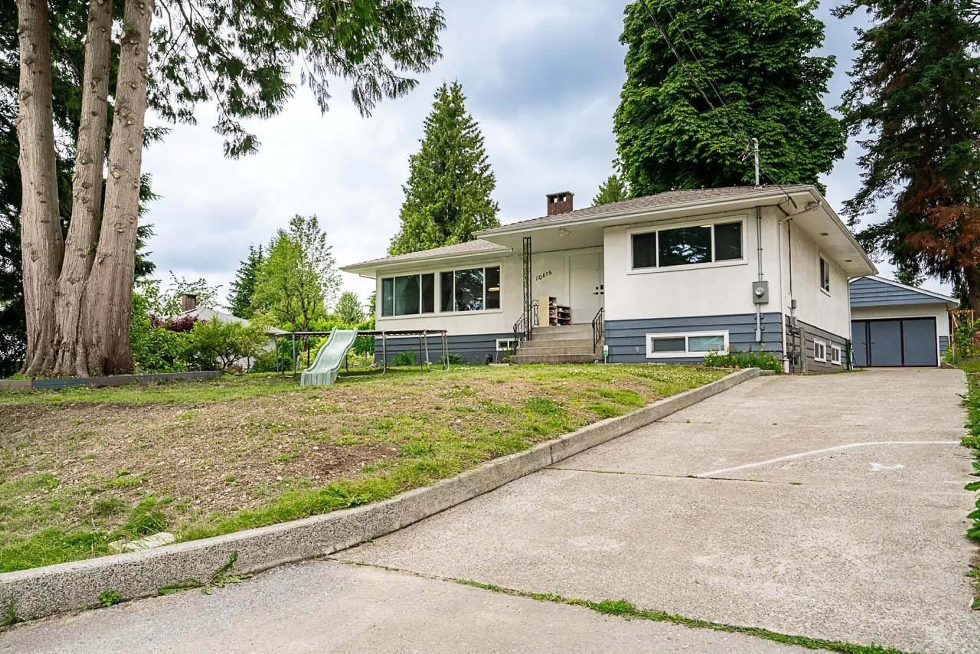 A pic from outside/outdoor area/front of a property/back of a property/a pic from drone, street for 10875 143 STREET, Surrey British Columbia V3R3M1